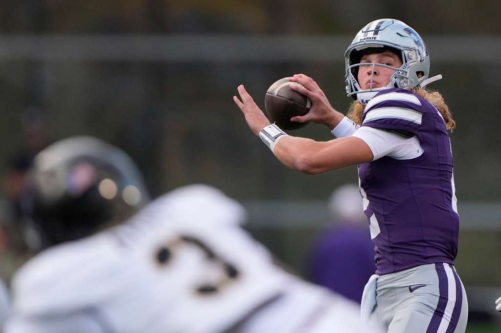 Kansas State quarterback Avery Johnson looks to pass during the first half of an NCAA college football game against Army, Saturday, Sept. 6, 2025, in Manhattan, Kan. (AP Photo/Charlie Riedel)