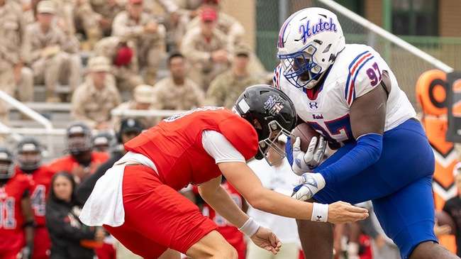 Jeffrey Manns (97) runs deep into NMMI territory after an interception in the No. 1-ranked Blue Dragons' 76-8 season-opening win over New Mexico Military on Saturday in Roswell, NM (Sydney Holzrichter/Blue Dragon Sports Information)