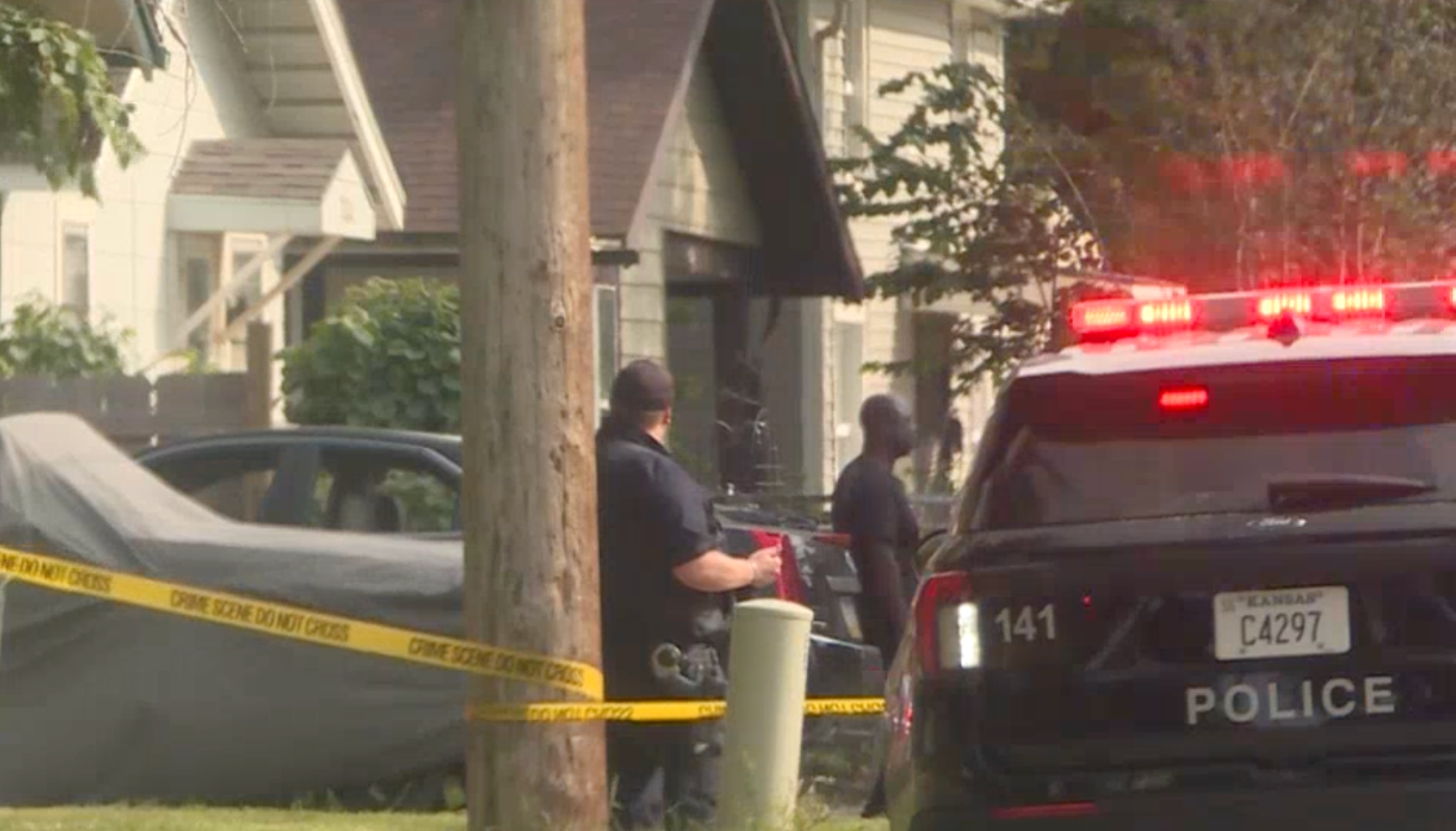 Police on the scene of the investigation on Sunday -photo courtesy KWCH