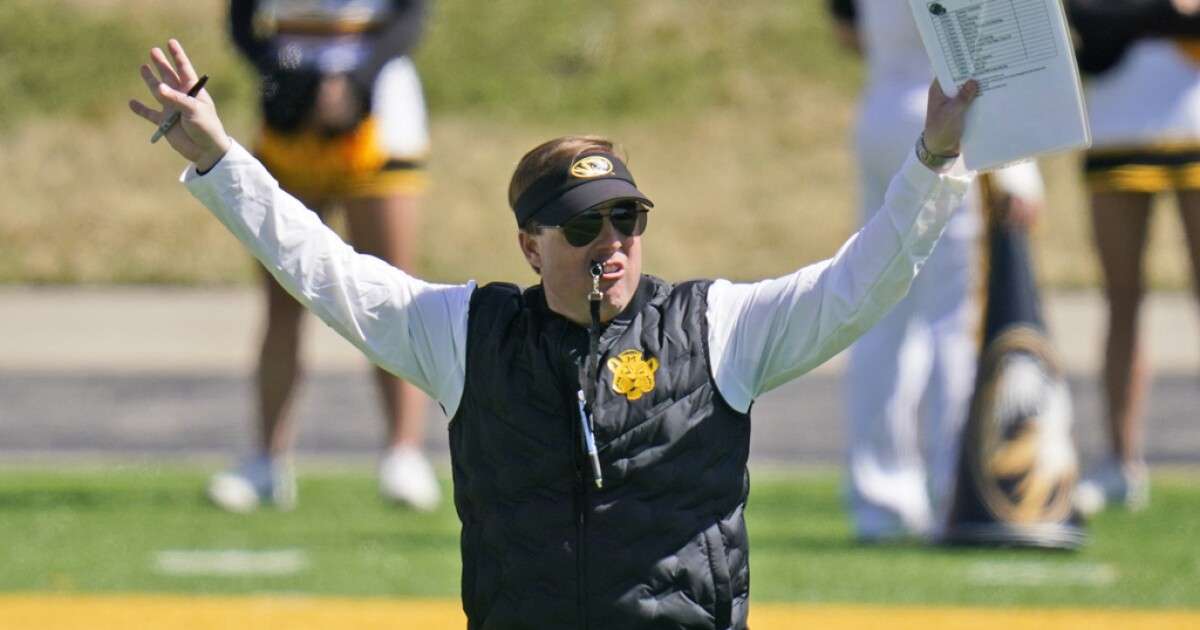 Missouri head coach Eliah Drinkwitz watches his team during an NCAA college football intra-squad spring game on March 19, 2022, in Columbia, Mo. (AP Photo/Jeff Roberson, File)