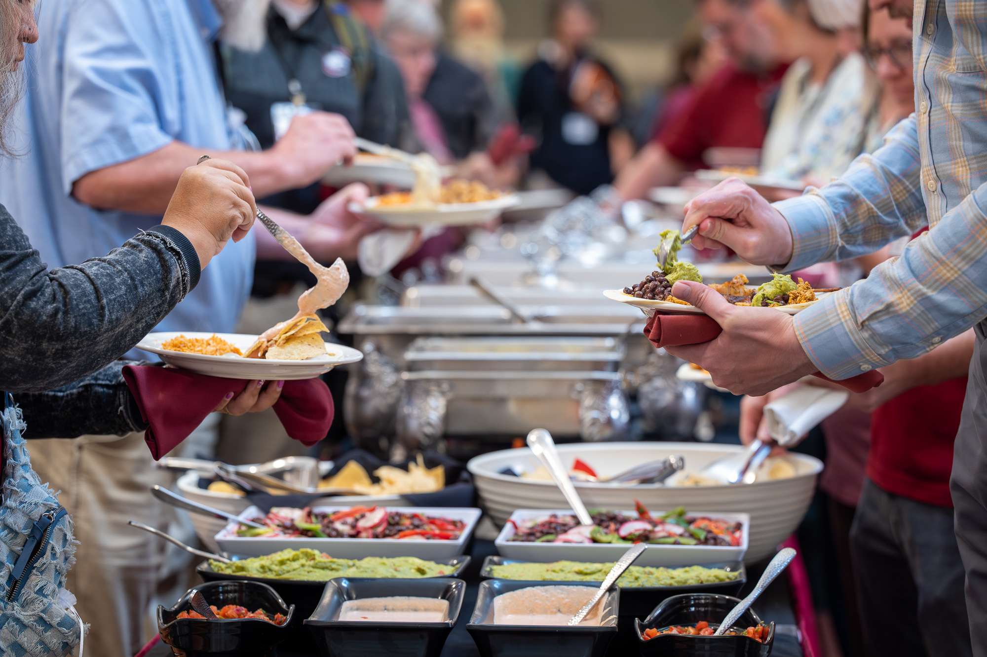 Chadron State College faculty and staff make their plates during the Eagle Success Summit lunch break in the Student Center, Aug. 29, 2025. (Photo by Sydney Brown/Chadron State College)