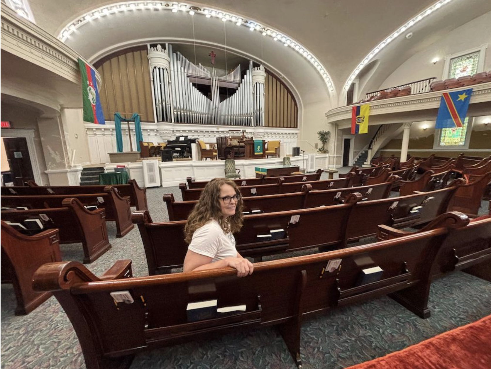 The Rev. Mindy Fugarino, senior pastor of Independence Boulevard Christian Church, sits inside the church’s sanctuary on Monday, Sept. 8. Fugarino opposes a plan to gerrymander Missouri’s congressional districts (Jonathan Shorman/Stateline).