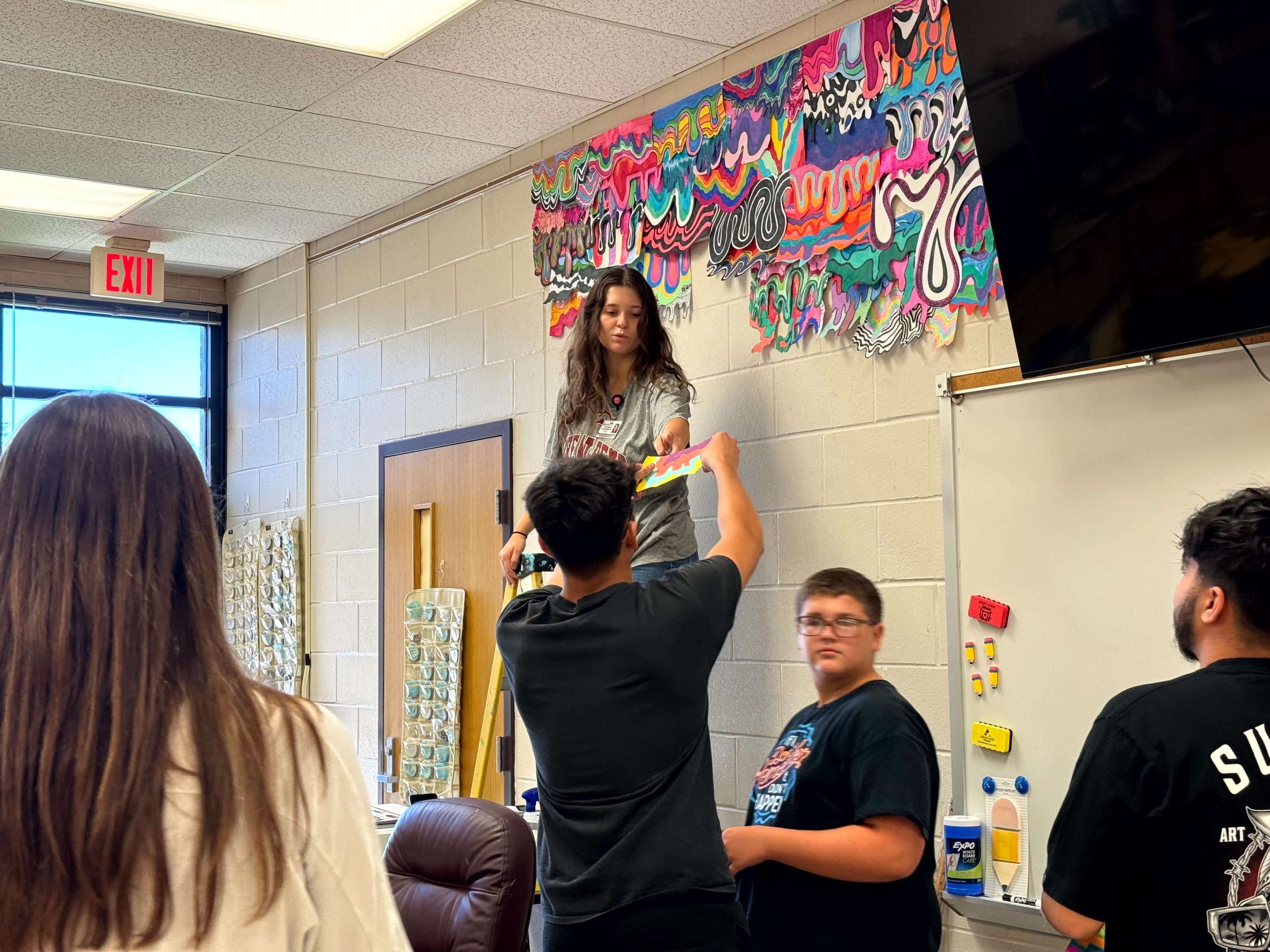 GBHS students in Anna Popp’s art classes collaborated to create a colorful drip mural installation. Nearly 100 students contributed individual pieces, which were assembled into a large-scale display that now brightens the classroom walls.