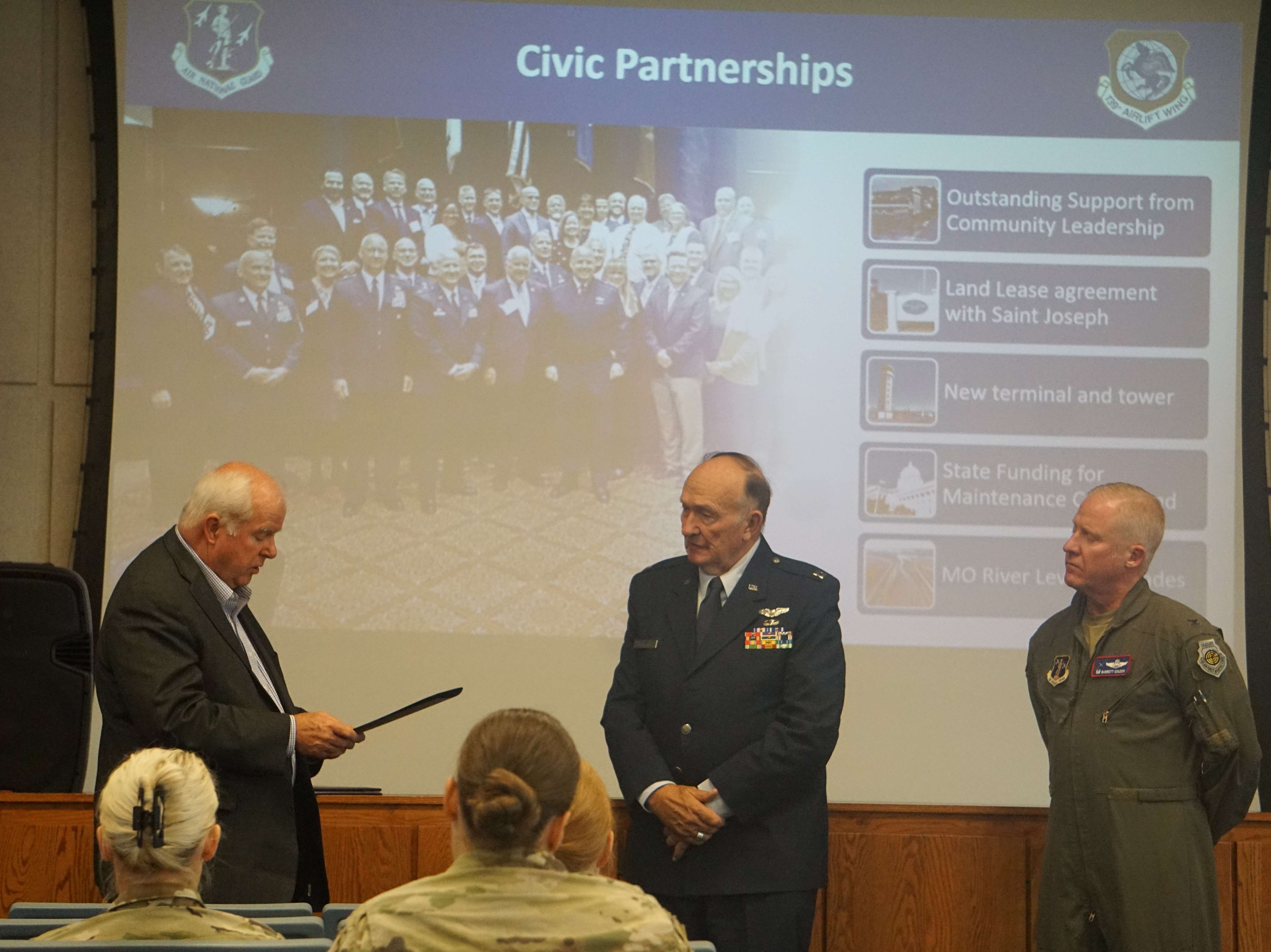Mayor John Josendale reads a proclamation during Captain Guy Gruters visit to the 139th Airlift Wing/ Photo by Matt Pike