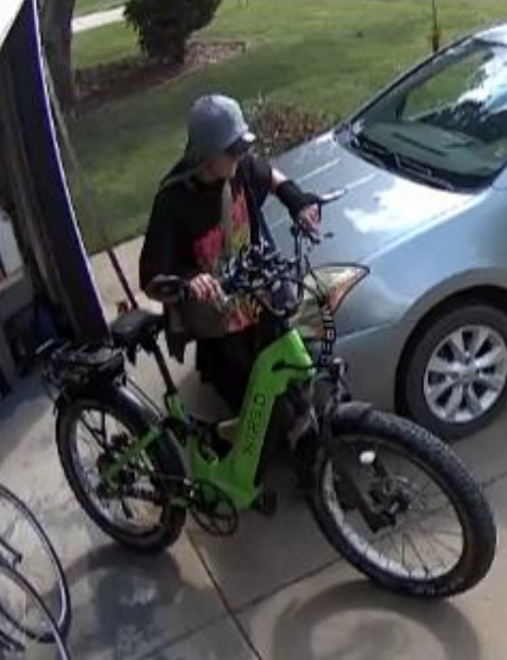 Surveillance footage of suspect stealing lime green e-bike from a home in South Salina on Monday, September 1, 2025. Courtesy of Salina Police Department