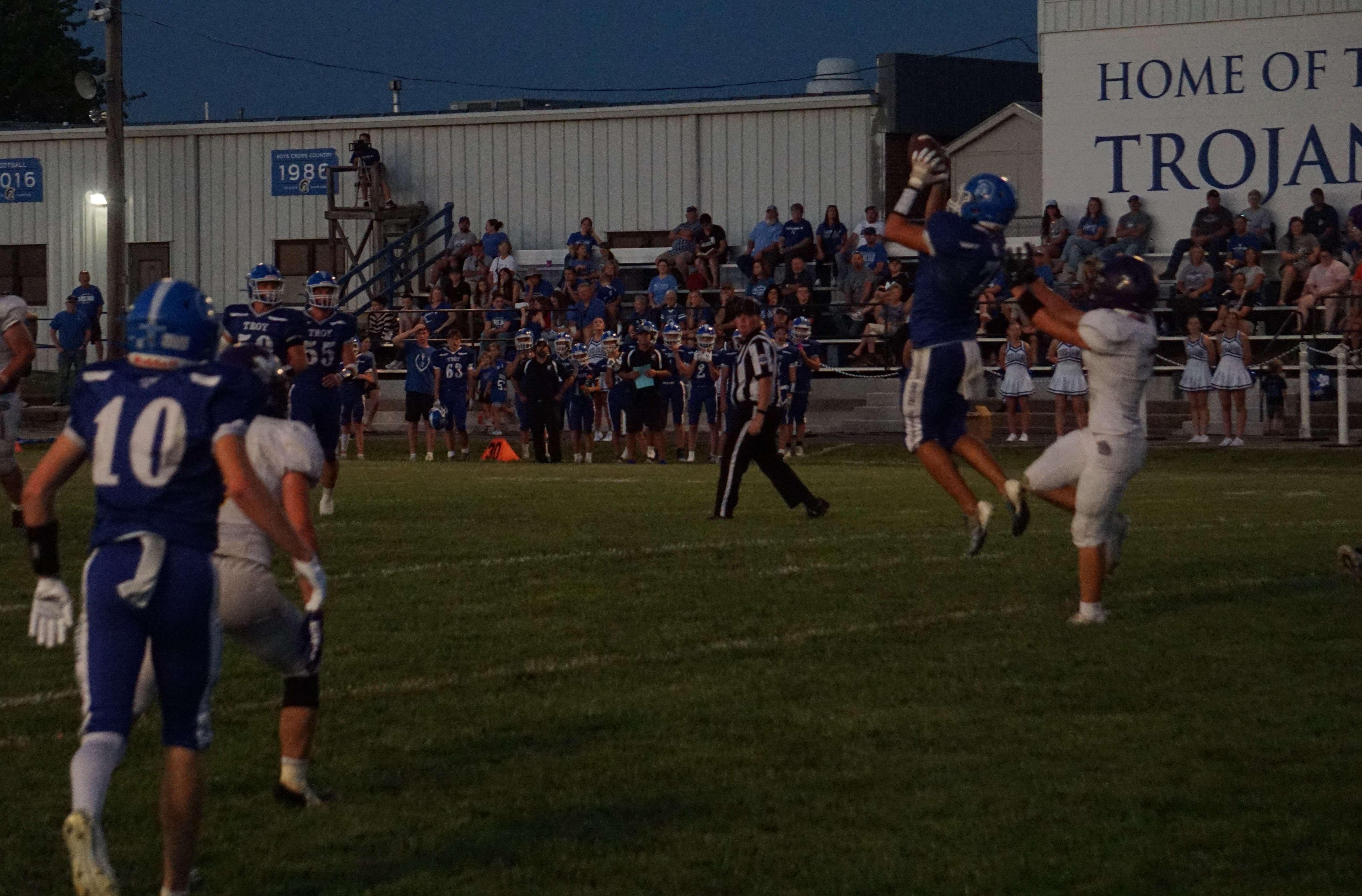 Troy's Caden Rosenberger goes up for a touchdown catch against the McLouth Bulldogs/ Photo by Matt Pike