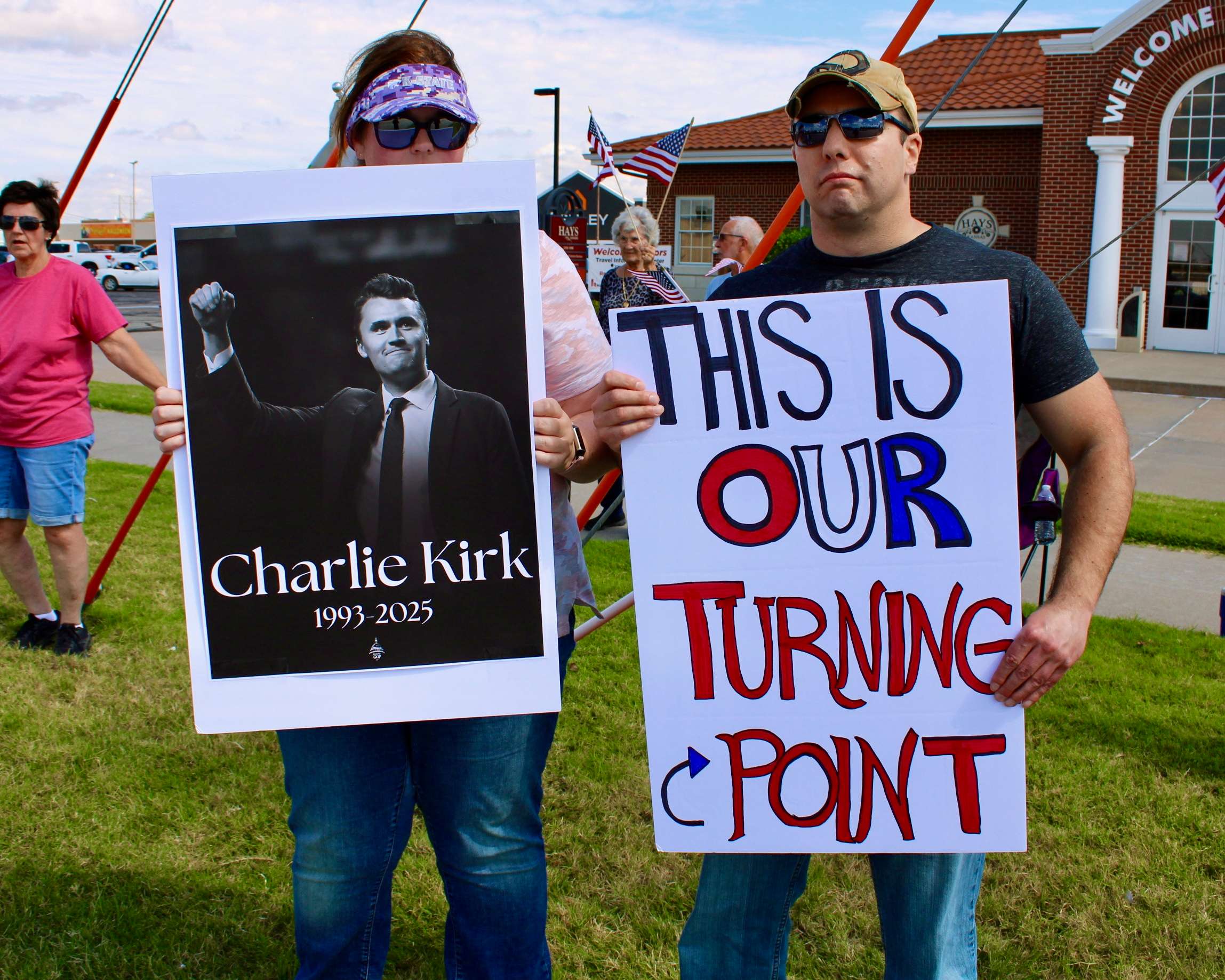 Adam Peters, chairman of the Ellis County GOP, with a sign on the corner of 27th and Vine in Hays. Photo by Tony Guerrero/Hays Post