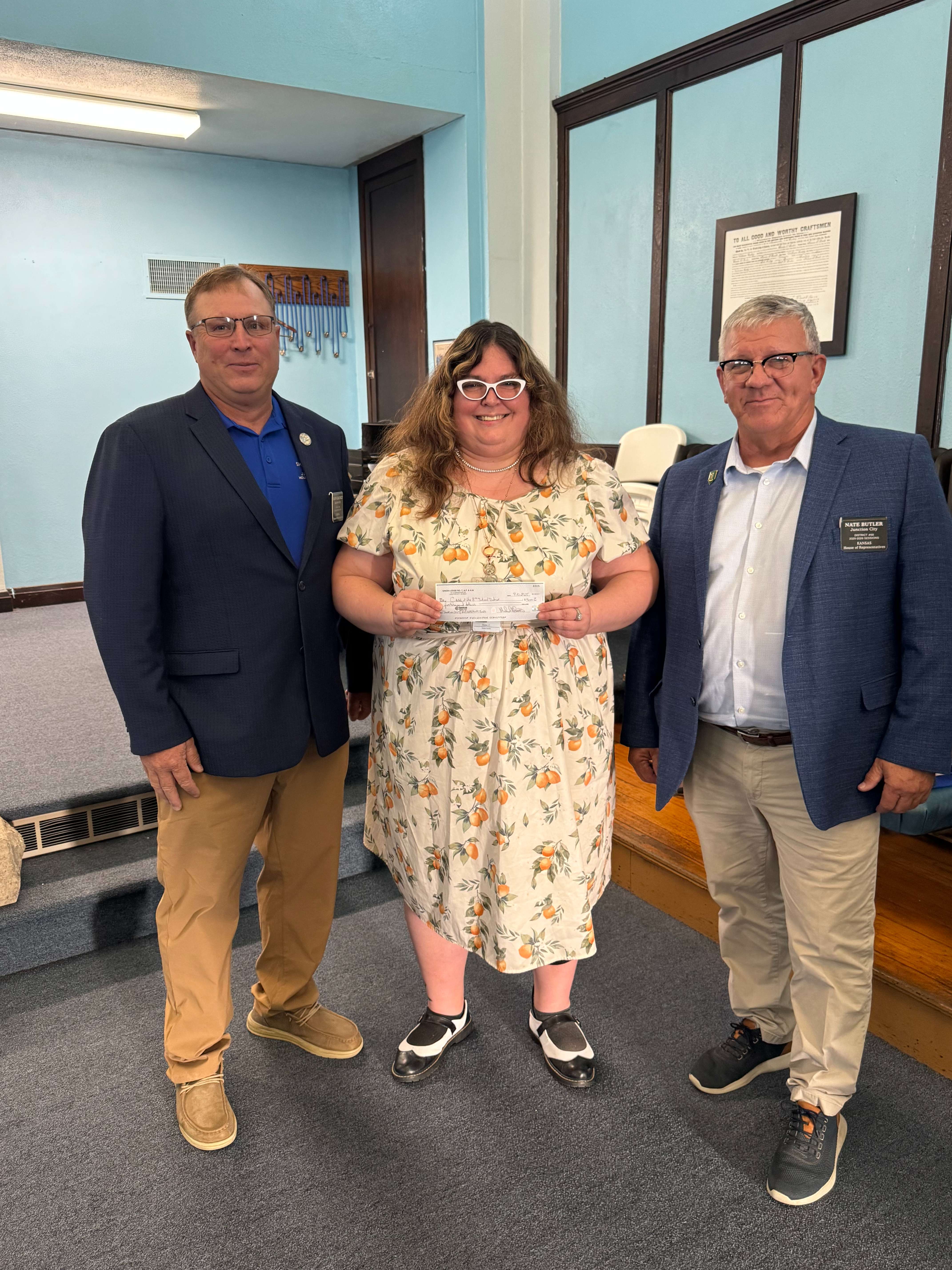 Left to right - State Representative Shawn Chauncey (65th District), CASA of Eighth Judicial District Executive Director Crystal Quinn, and State Representative Nate Butler (68th District). 