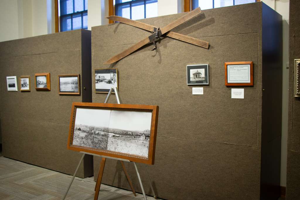 Historic photographs and a pair of skis are displayed in the Mari Sandoz High Plains Heritage Center as part of the Mabel's Time in Crawford exhibit Aug. 26, 2025. (Photo by Shelby Westinghouse/Chadron State College)