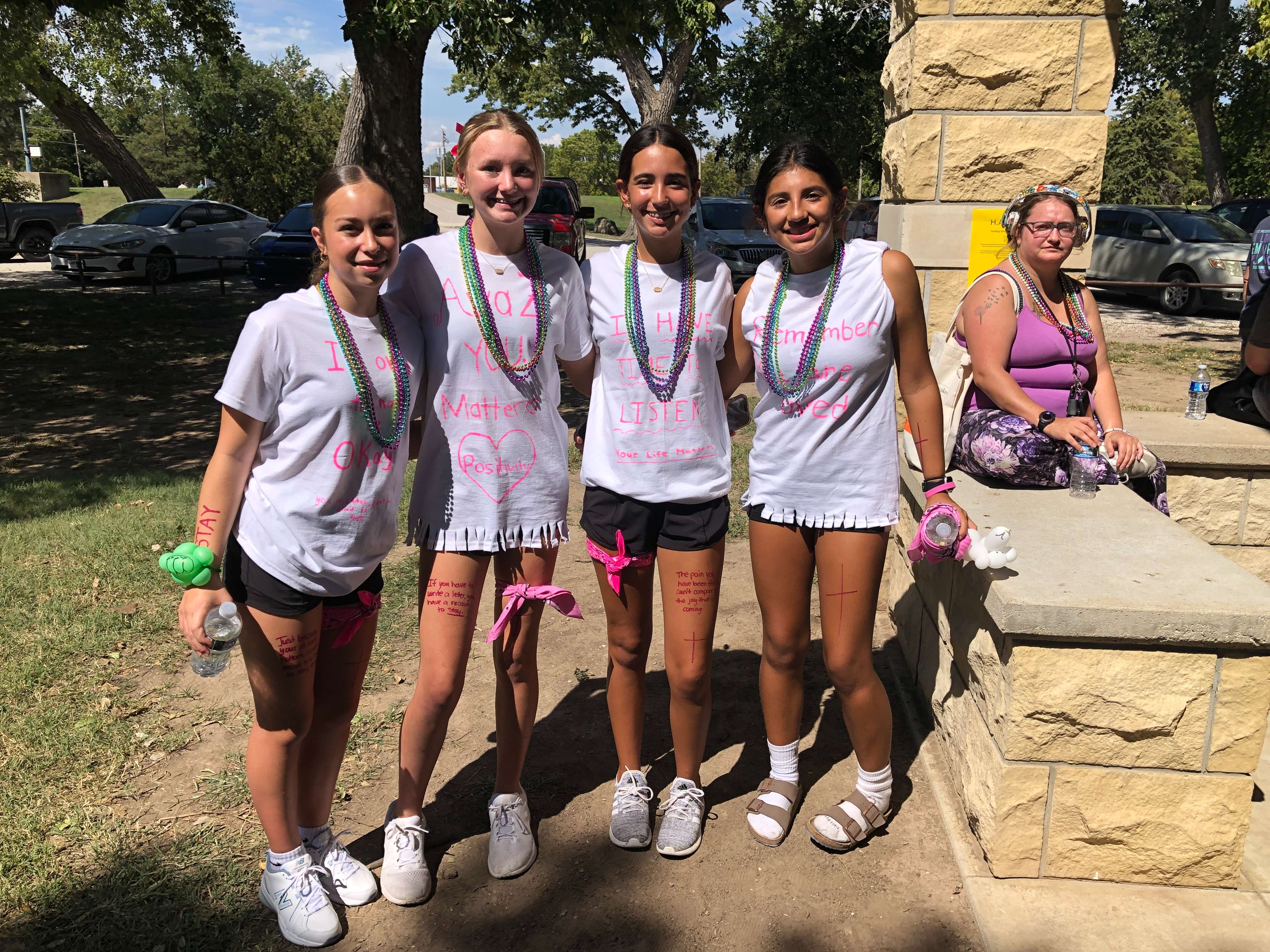 A group of middle school students who participated in the Out of Darkness Walk created their T-shirts with encouraging messages.&nbsp;Photo by Cristina Janney/Hays Post