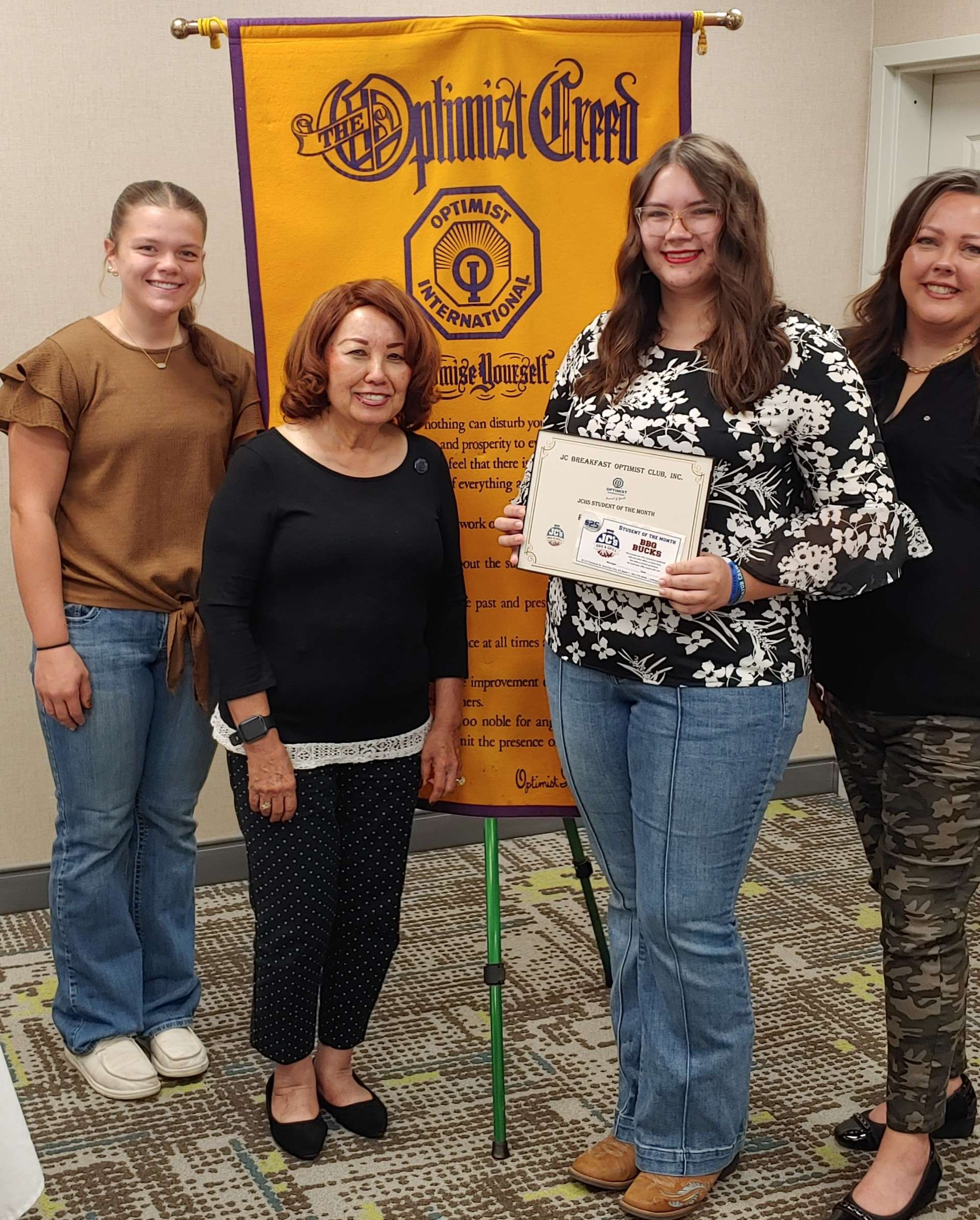 Pictured left to right are: Morgan Nabus, President of the JCHS Junior Optimist Club; Nita Miller, President of the JC Breakfast Optimist Club; Riley Sams-Frost and Sarah Frost, Riley's mother. 
