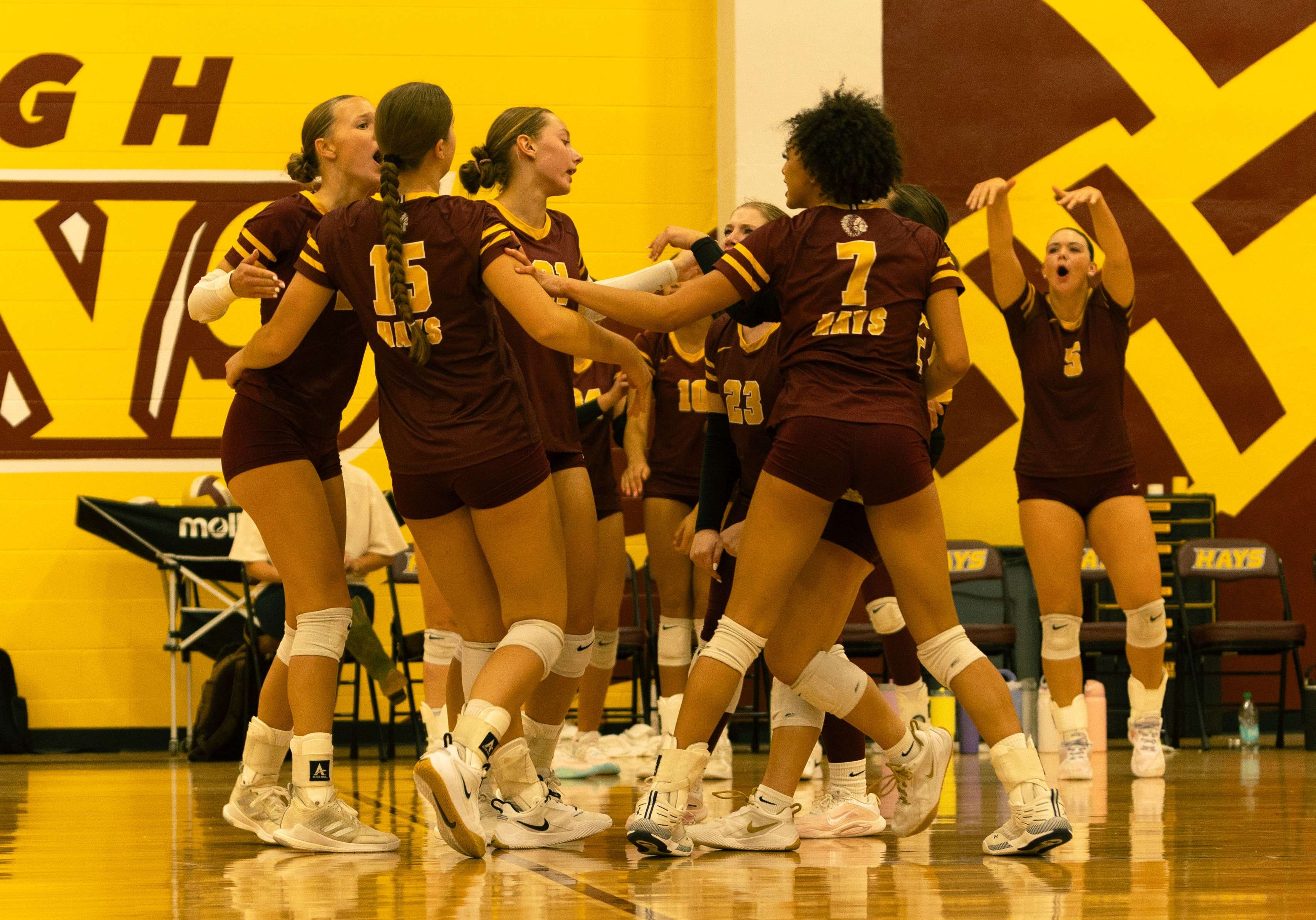 The Hays High School volleyball team celebrates after scoring a point at a quadrangular on Thursday, September 18, 2025 in Hays, Kan. (Courtesy photo)