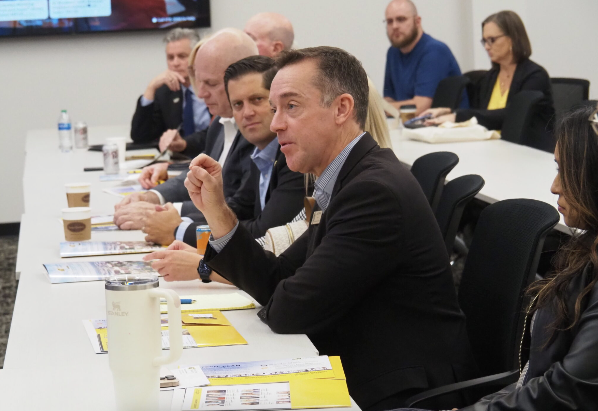 Blake Benson, chairman of the Kansas Board of Regents, says a modest $4.6 million cut in state aid to higher education may be palatable to the Kansas Legislature, which is likely to pursue greater budget austerity in the upcoming session. In this image, Benson tours the Wichita State University campus with other members of the Board of Regents in October 2024. (Tim Carpenter/Kansas Reflector)
