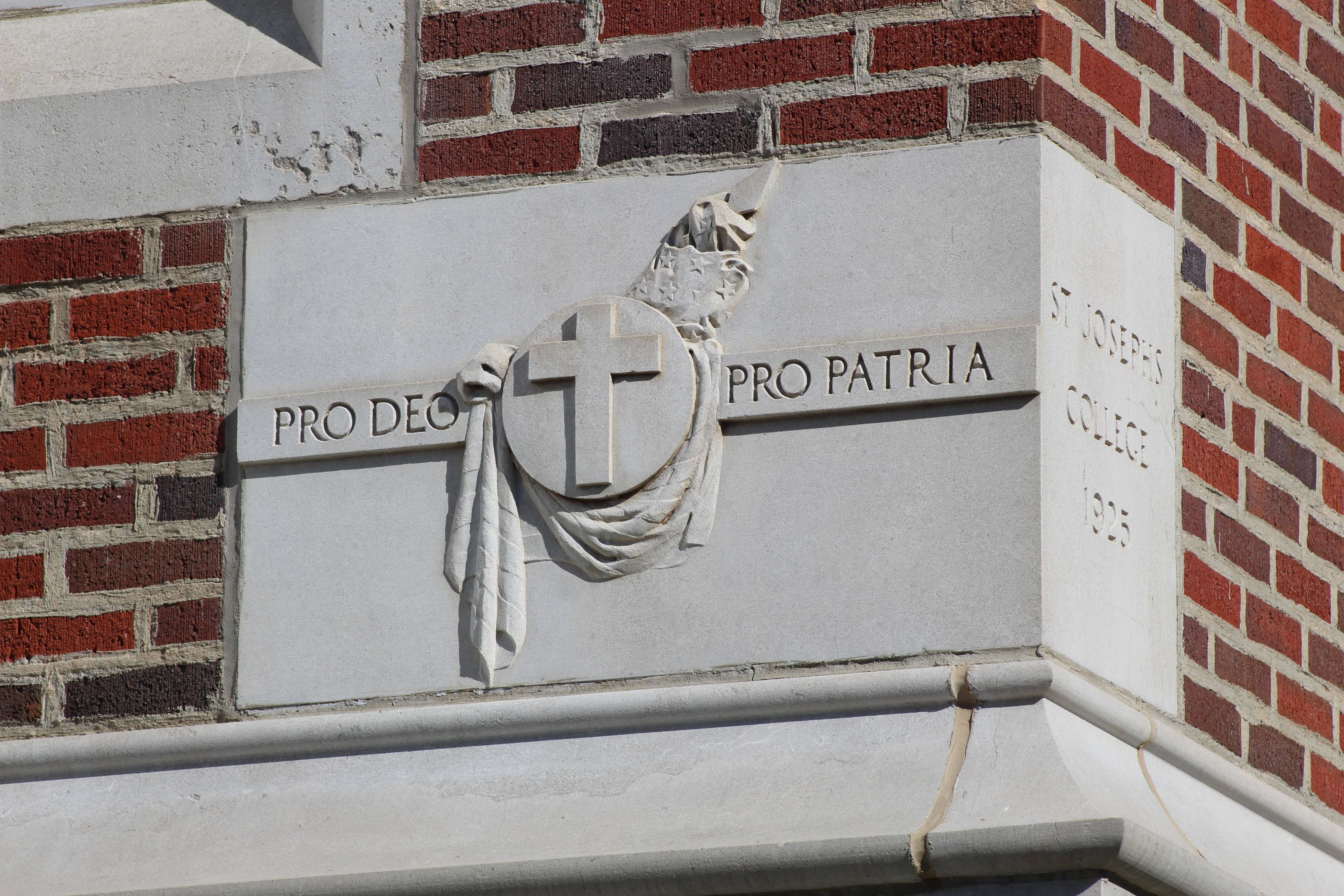 The TMP-Marian cornerstone, which reads "For God, for country." Photo by Cristina Janney/Hays Post