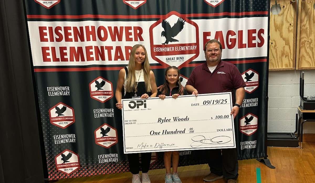 Eisenhower fourth grader Rylee Woods, pictured with her teacher, Mrs. Gates, and Joey from OPI, was selected as the third winner of this Make a Difference contest.