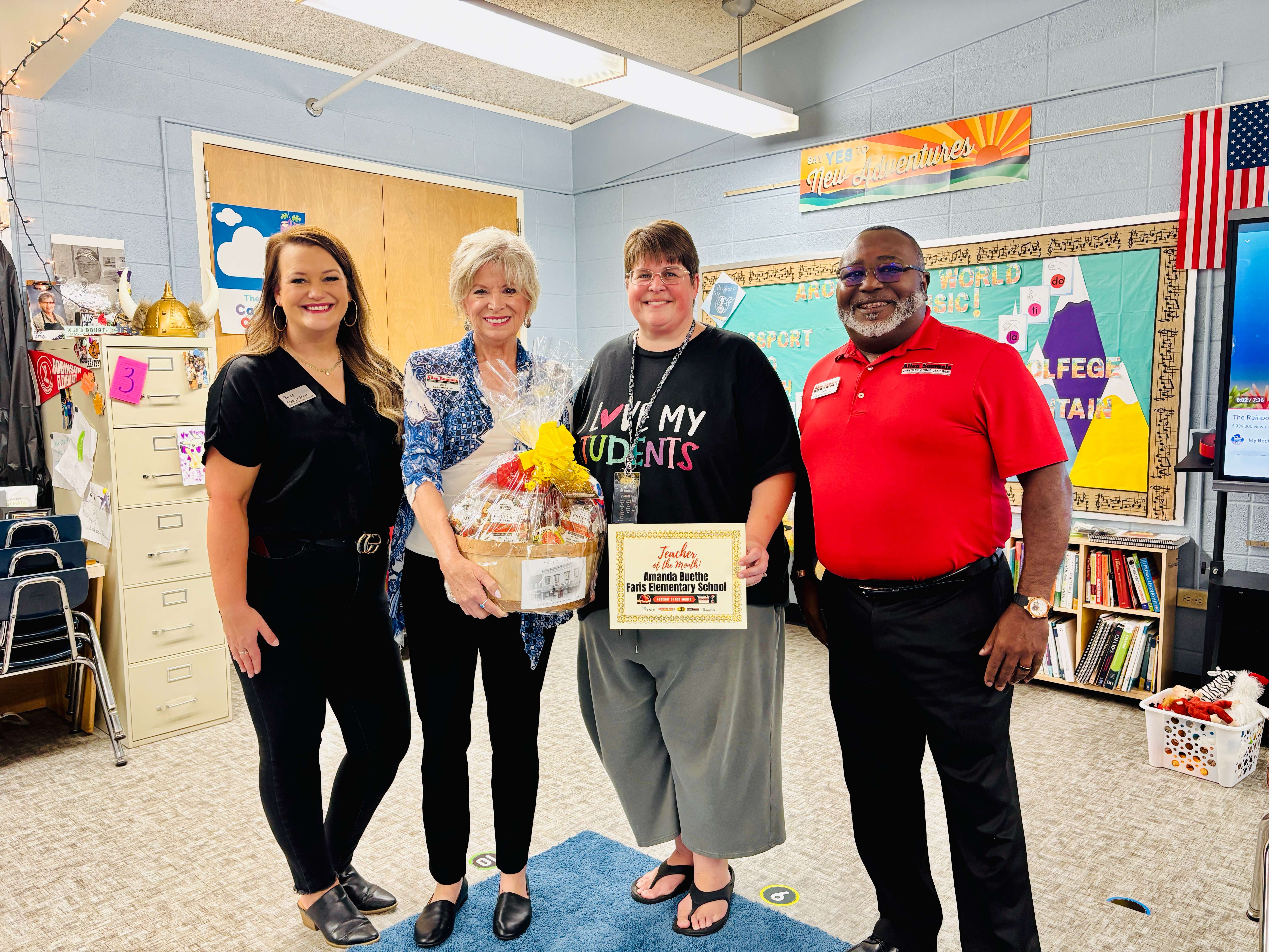 From left, Ashley Weve, digital manager at Eagle Media; Cris Schul of Allen Samuels Chrysler Dodge Jeep Ram; Amanda Buethe, 2nd grade teacher at Faris Elementary School; and Don Glaspie, general manager of Allen Samuels Chrysler Dodge Jeep Ram, pose after Buethe received the Teacher of the Month award for September. (Hutch Post Photo)