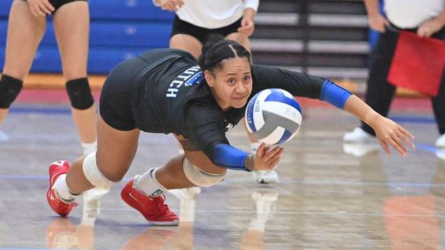 Angela Reupena had her second double-double of the seaosn with 23 assists and 10 digs, but the Blue Dragons fell in five set to Seward County on Wednesday at the Sports Arena. (Andrew Carpenter/Digital Fox Photography)