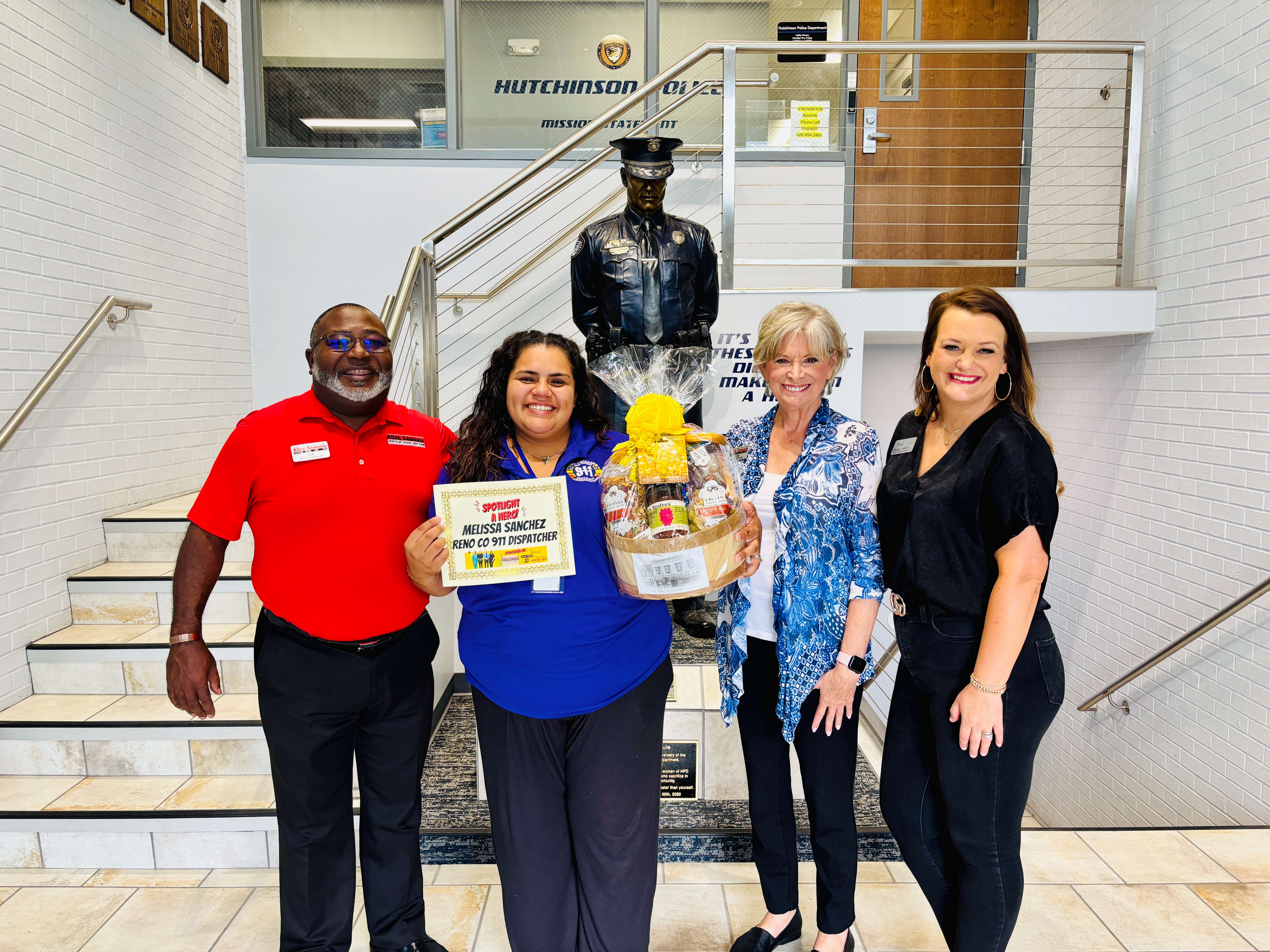 From left, Don Glaspie, general manager of Allen Samuels Chrysler Dodge Jeep Ram; Melissa Sanchez, a 911 dispatcher with Reno County Emergency Communications; Kris Schul of Allen Samuels Chrysler Dodge Jeep Ram; and Ashley Weve, digital manager at Eagle Media, pose after Sanchez received the Allen Samuels Chrysler Dodge Jeep Ram First Responder of the Month award for September. (Hutch Post Photo)