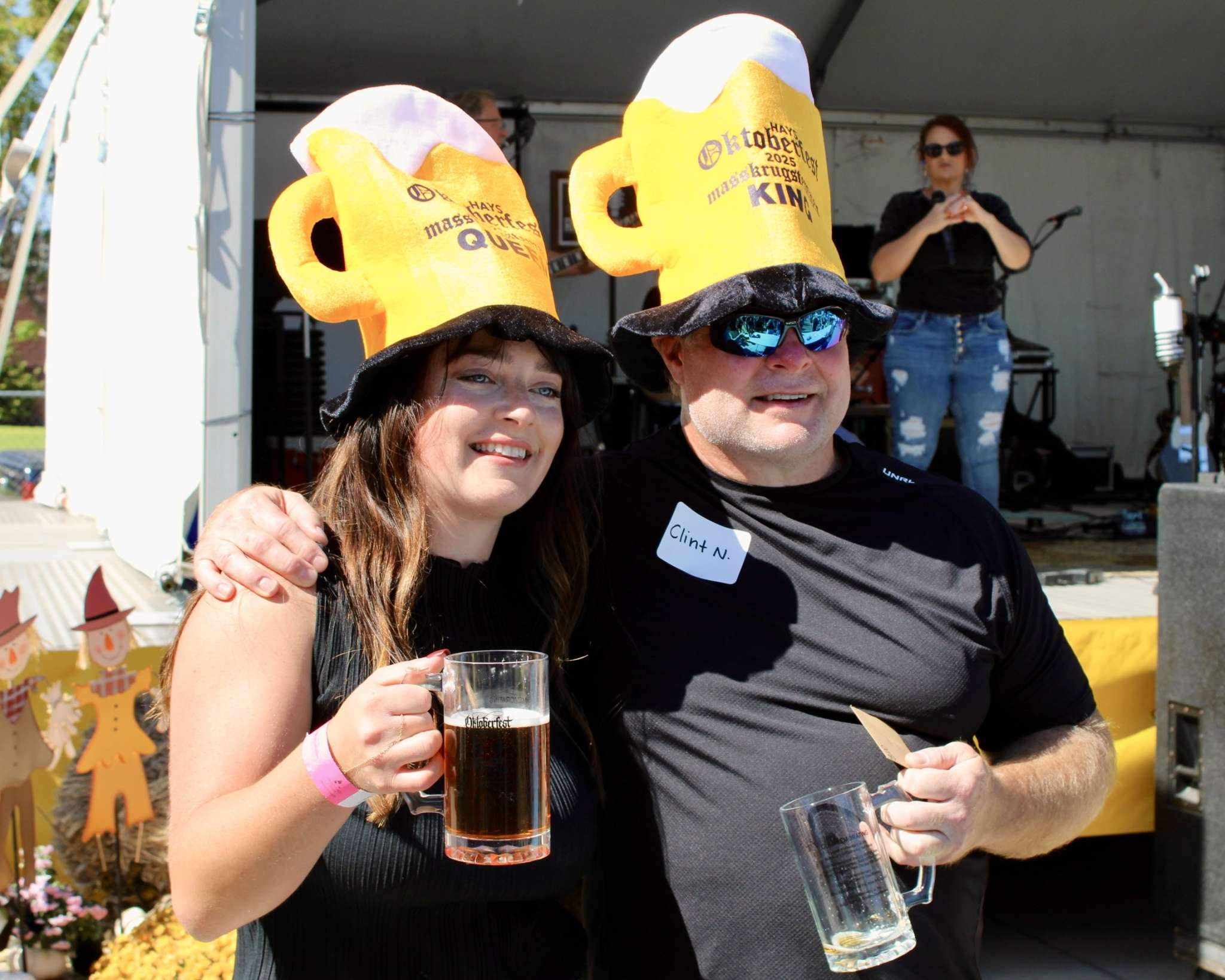 Sophie Humphrey, winner of the women's Stein Holding Contest, and Clint Newell, winner of the men's Stein Holding Contest. Photo by Tony Guerrero/Hays Post