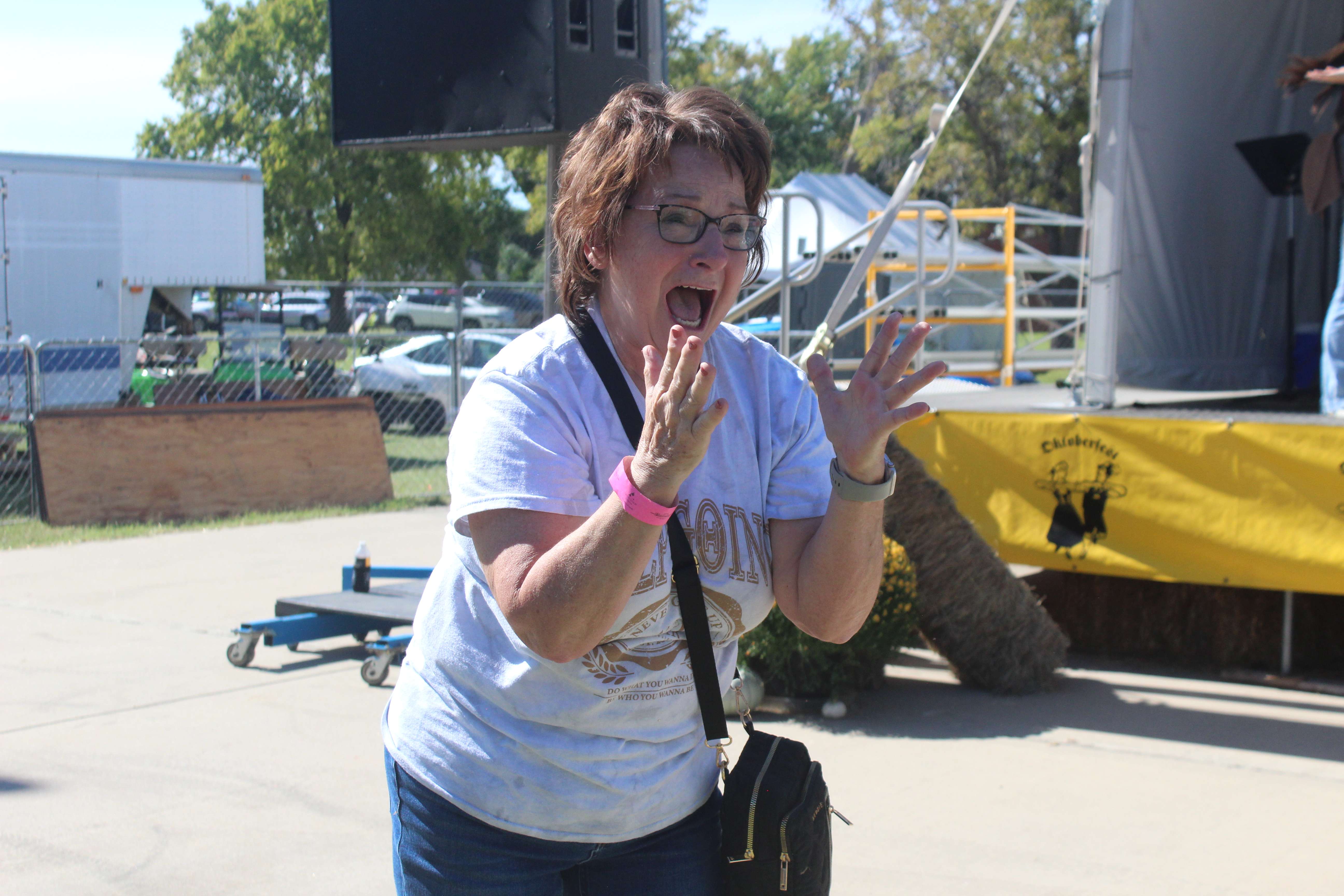 Bernita Augustine reacts to winning the Yuengling Flight Golf Cart on Friday.