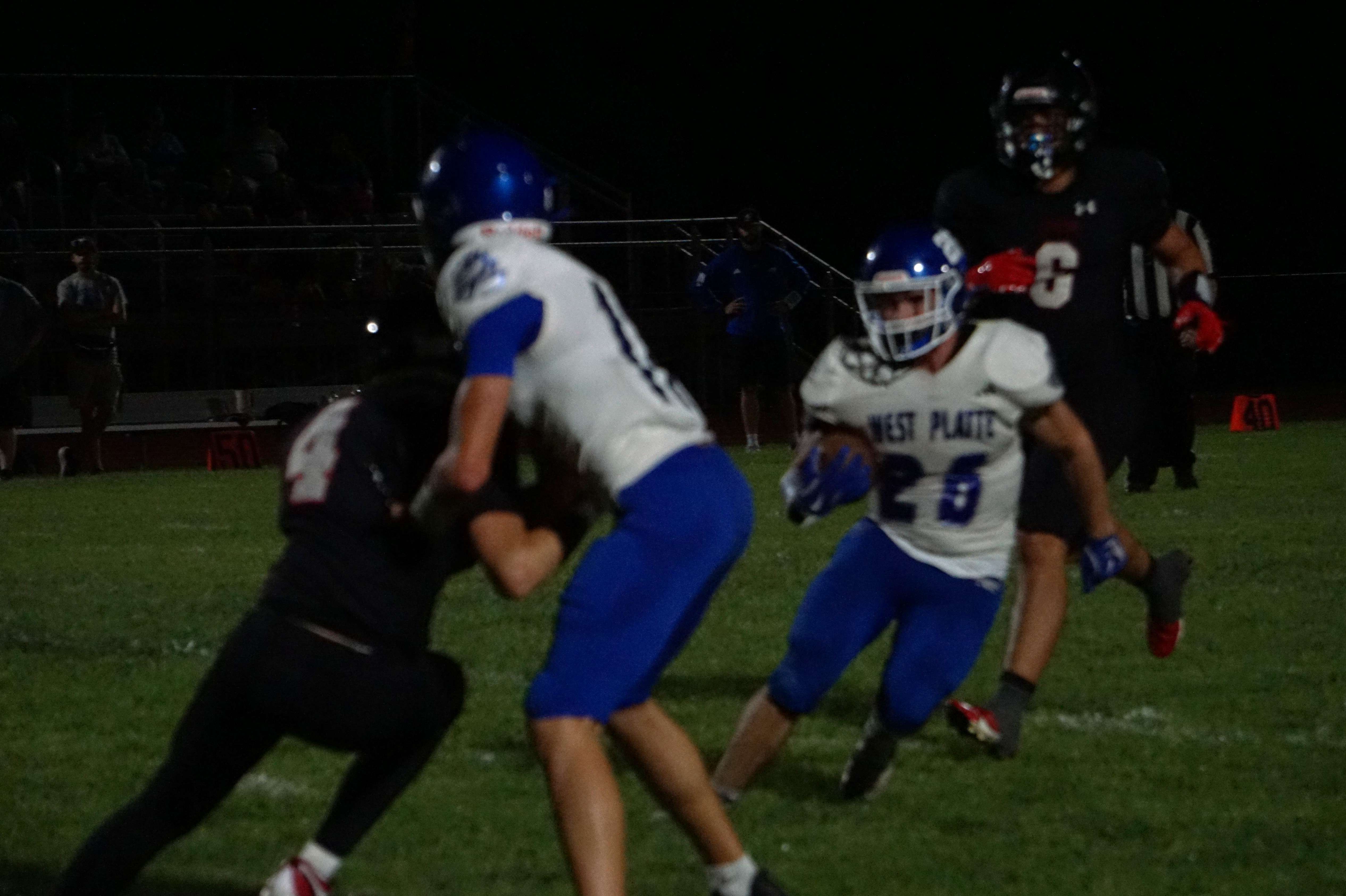West Platte's Brady McMillan (26) breaks around a block for a big run against Plattsburg/ Photo by Matt Pike