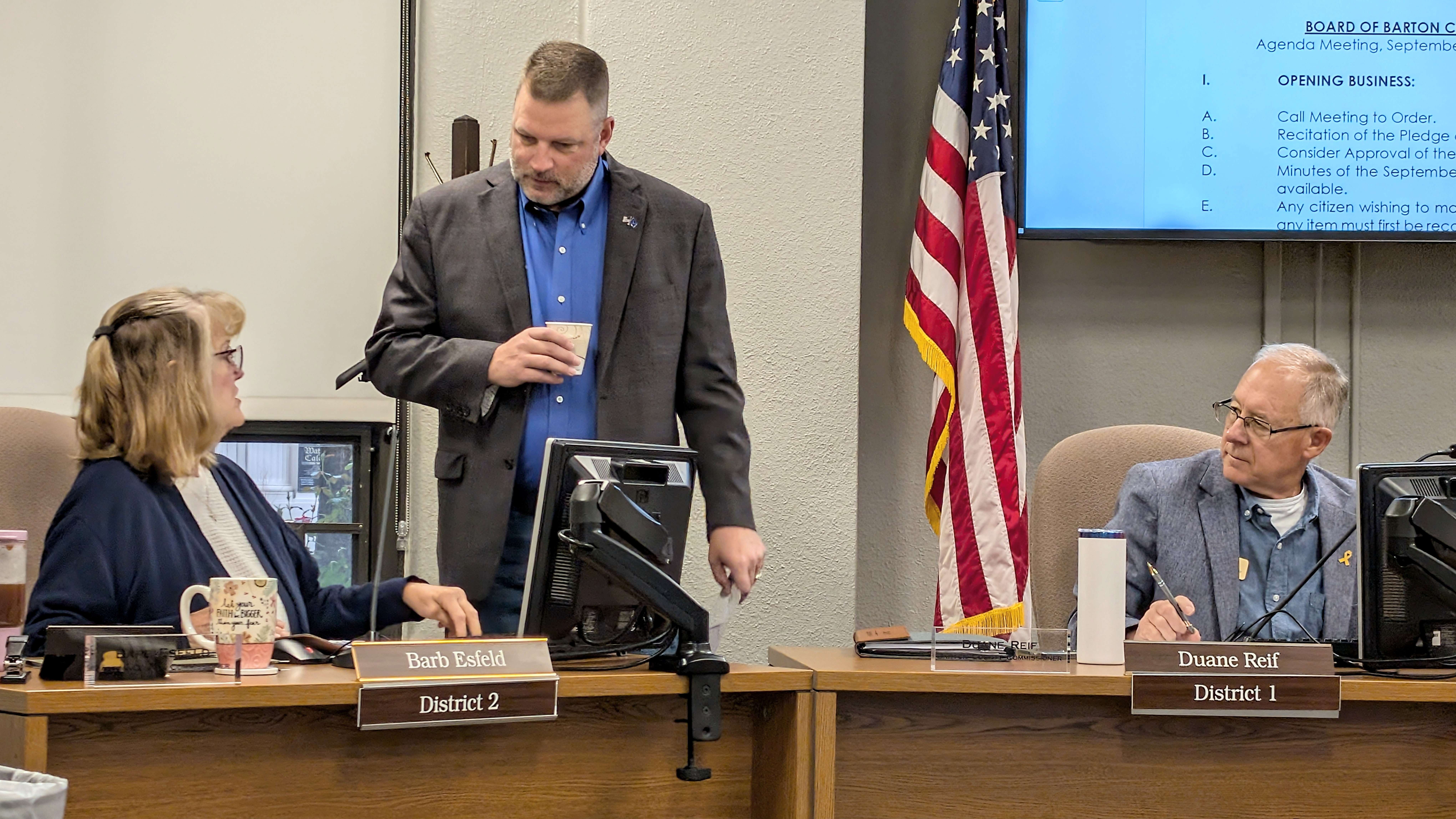 <b>B</b>arton County Commissioner Barb Esfeld, left, visits with commissioners Shawn Hutchinson, center, and Duane Reif before the commission meeting Tuesday morning about the 2025 Kansas Legislative Police Group meeting she attended last week in Russell.