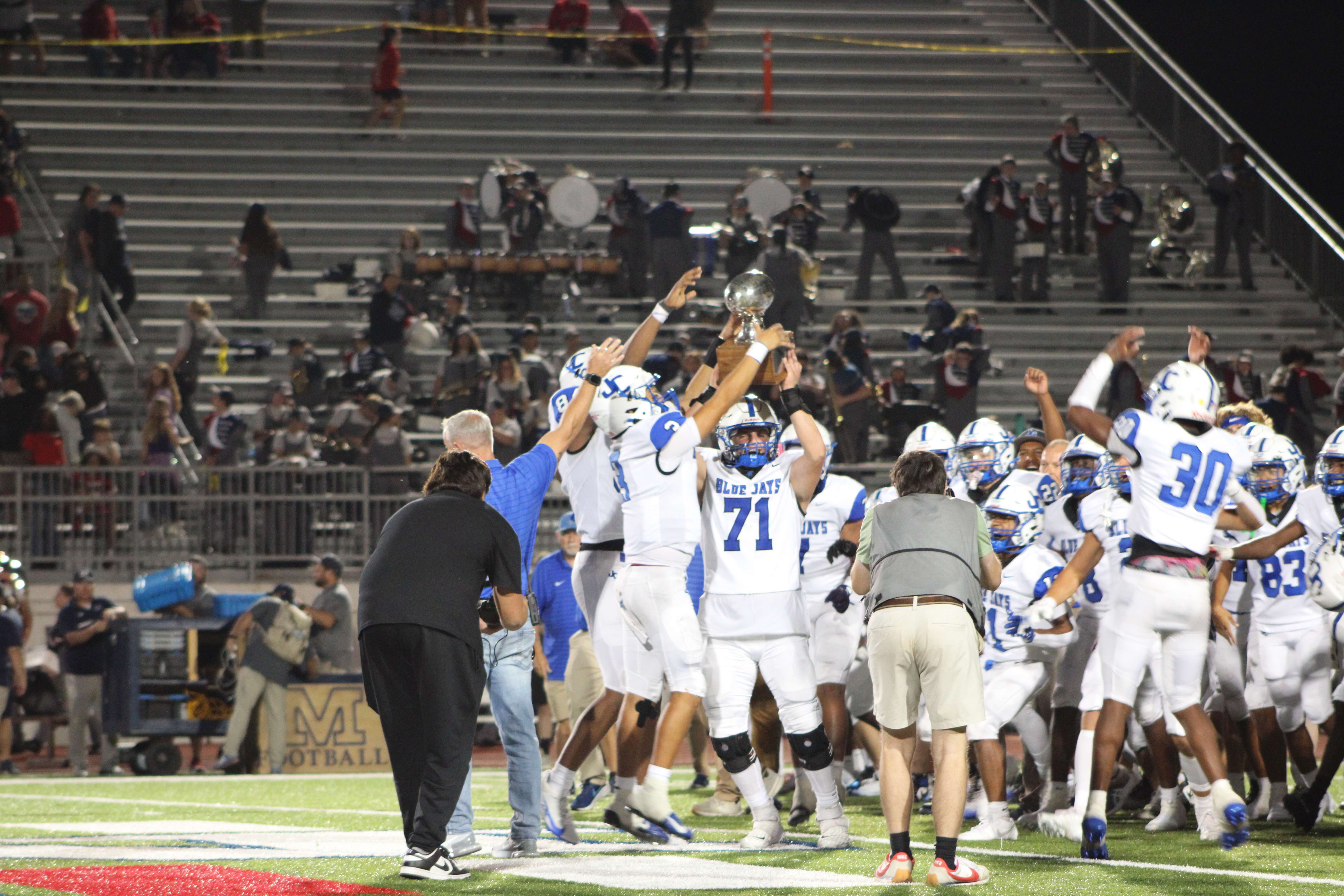 The Blue Jays celebrate and raise the Silver Trophy after knocking off 6A #1 Manhattan.