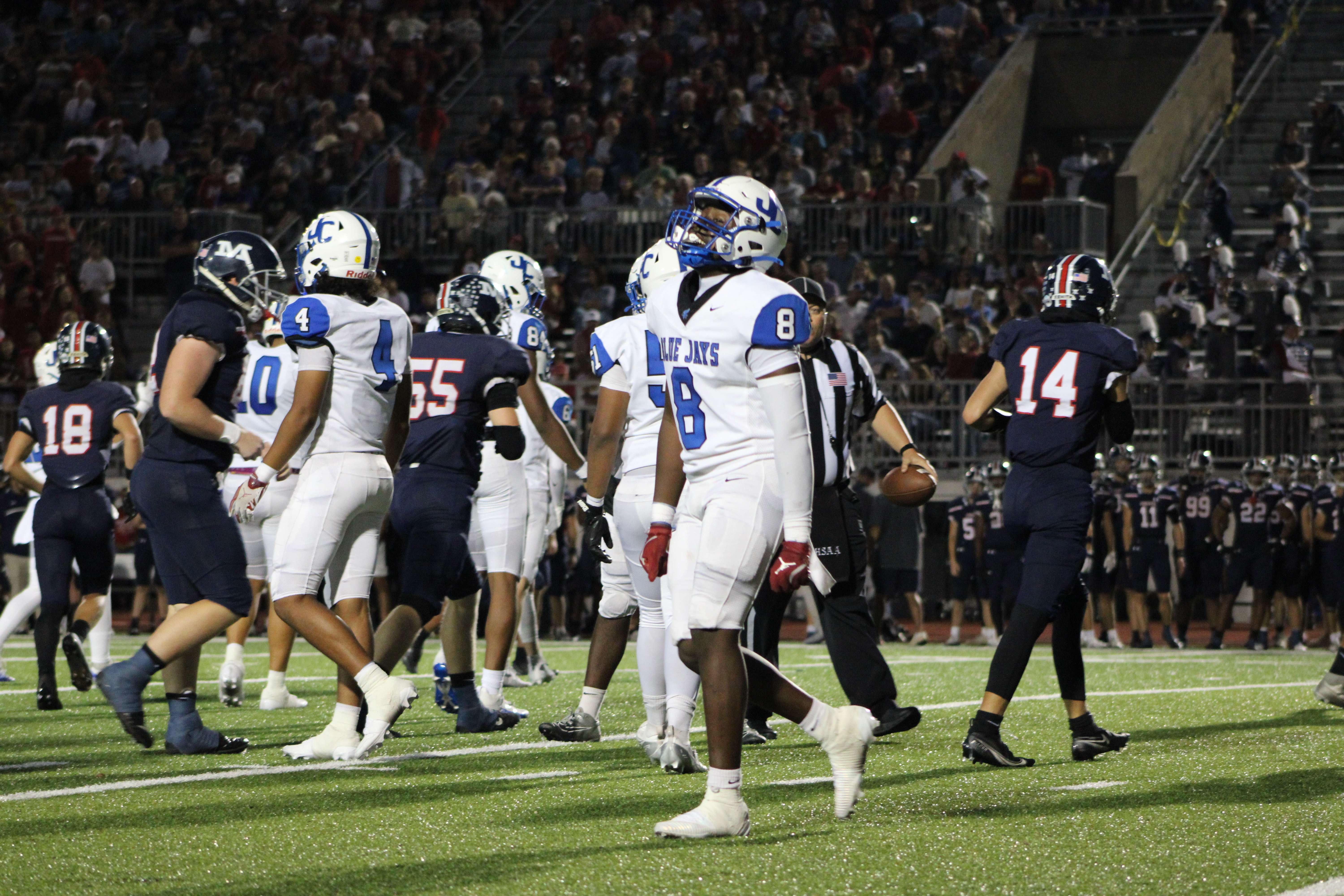 #8 Khaliel Walker celebrates as the Blue Jay defense stops Manhattan forcing a Turnover on Downs.