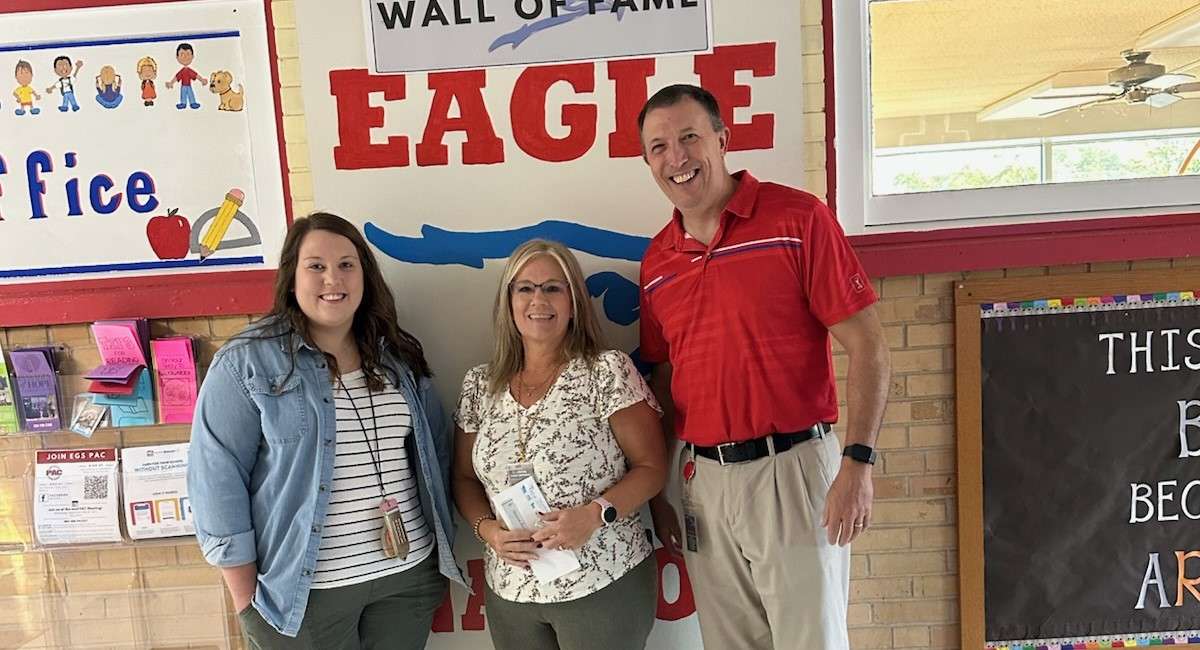 Ellinwood Grade School's Tammie Buckbee (center) with coworker Kristi Tucker and Principal Joel Kahnt.