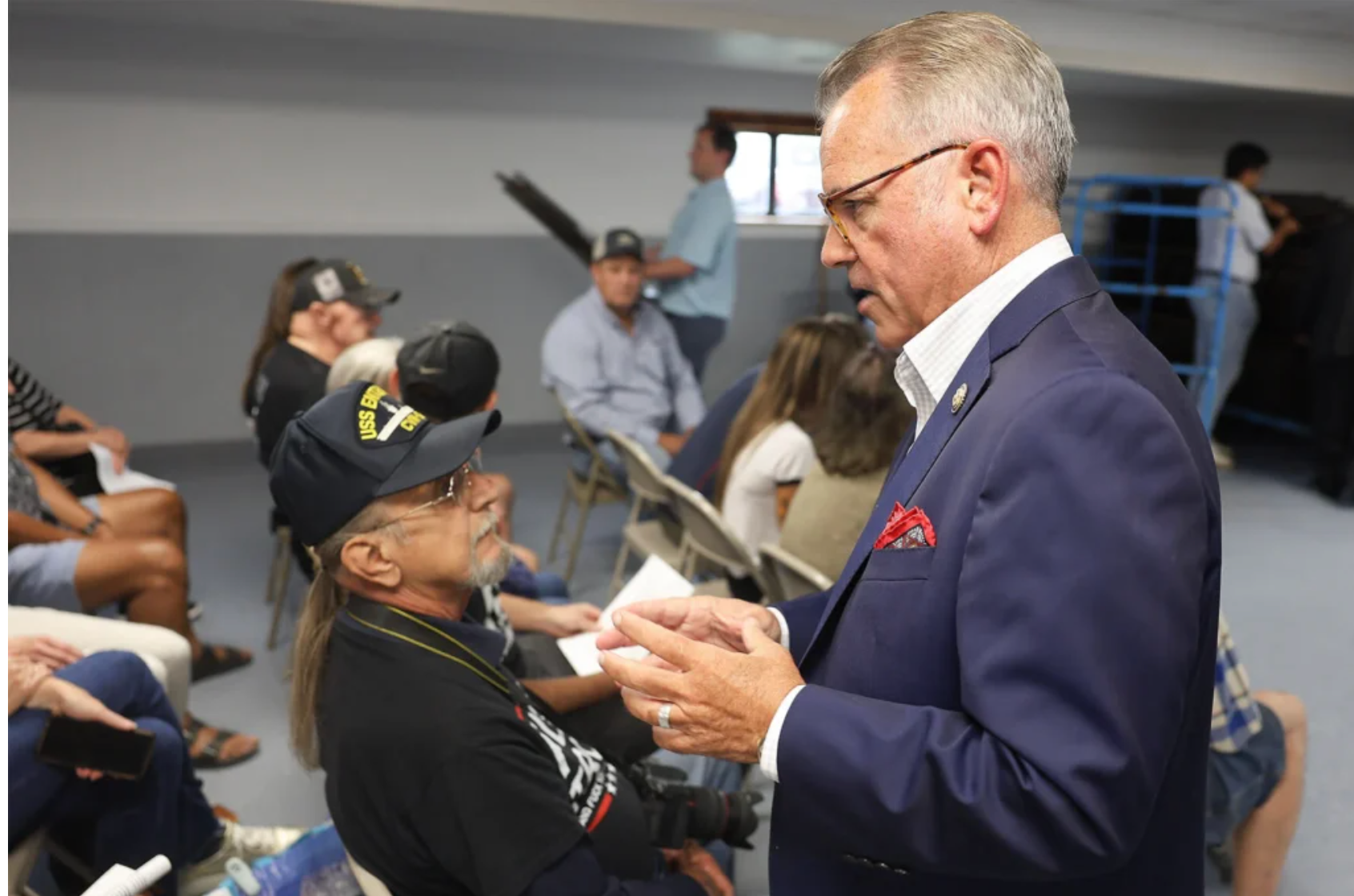 Rep. Mark Alford, right, introduces himself to Douglas Walther, left, before the town hall on Wednesday at the Lions Club in Harrisburg. An NPR tally reported that around 37 of the 219 U.S. House Republicans held town halls during the August recess (Aiyana Massie/Missourian).