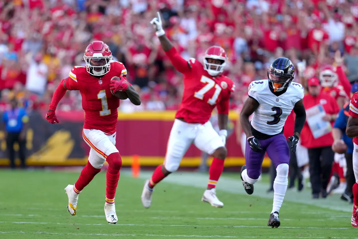 Kansas City Chiefs wide receiver Xavier Worthy (1) earns a first down as Baltimore Ravens cornerback Chidobe Awuzie (3) defends during the first half of an NFL football game Sunday, Sept. 28, 2025, in Kansas City, Mo. (AP Photo/Ed Zurga)