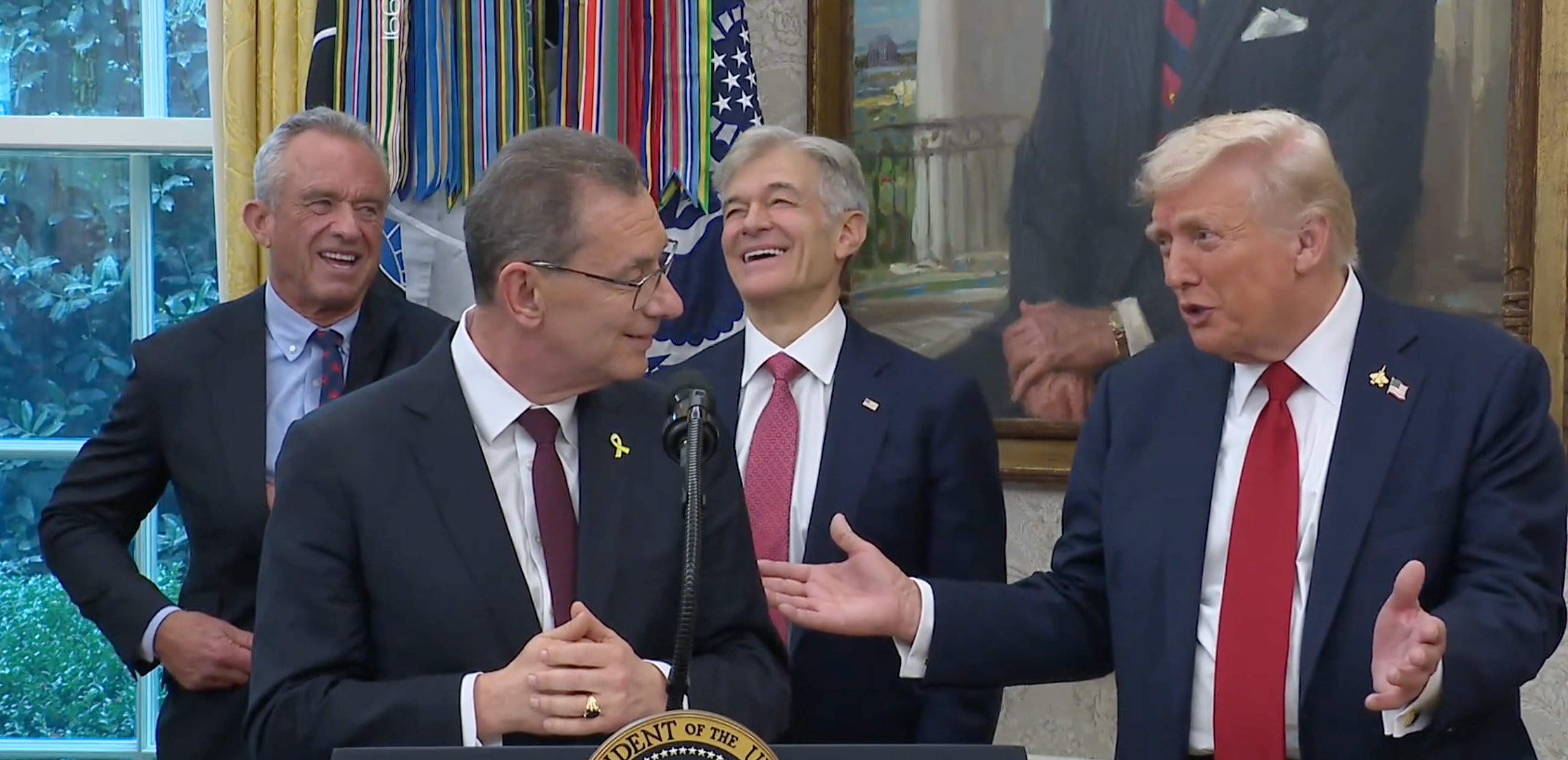 Pfizer CEO Albert Bourla, President Trump, RFK, Jr. and Dr. Oz enjoy a laugh in the Oval Office during the announcement -image from White House video