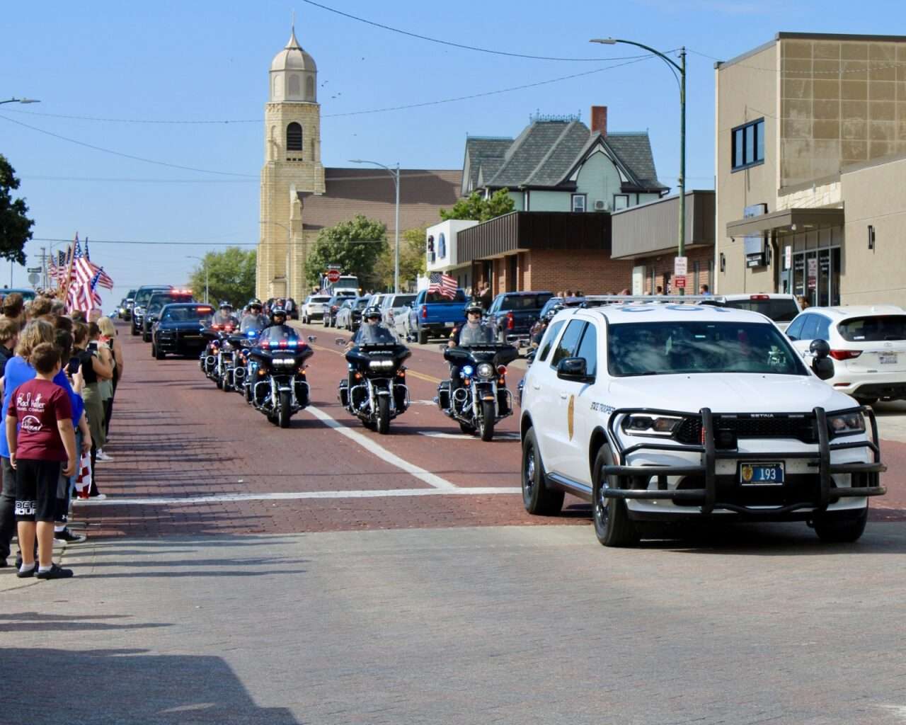 The arrival of the escort for Sgt. Scott Heimann's on Main Street in Hays. Photo by Tony Guerrero/Hays Post