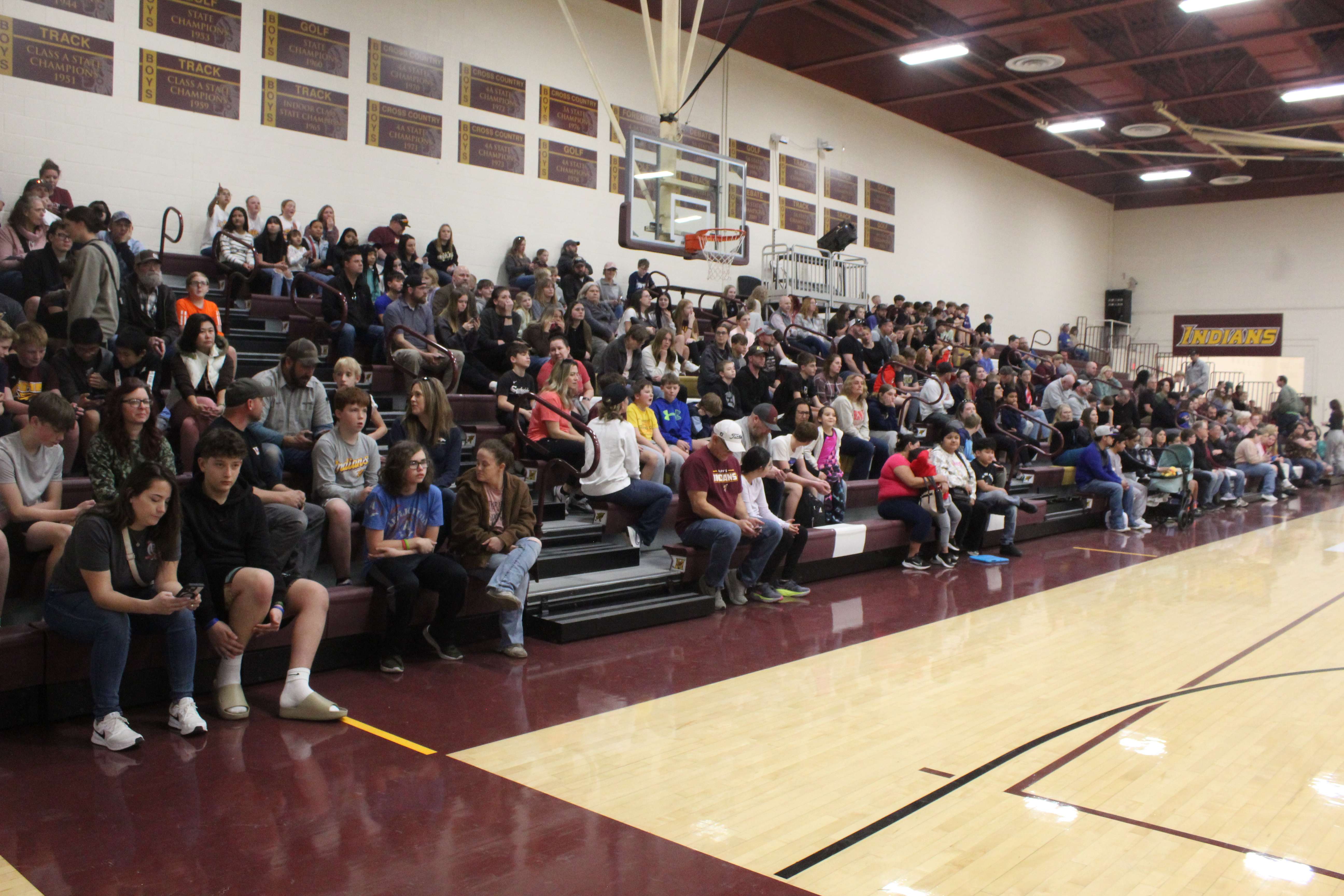 Students and parents gather in the main gym at HMS before touring the new location on Tuesday night. Photo by Cristina Janney/Hays Post