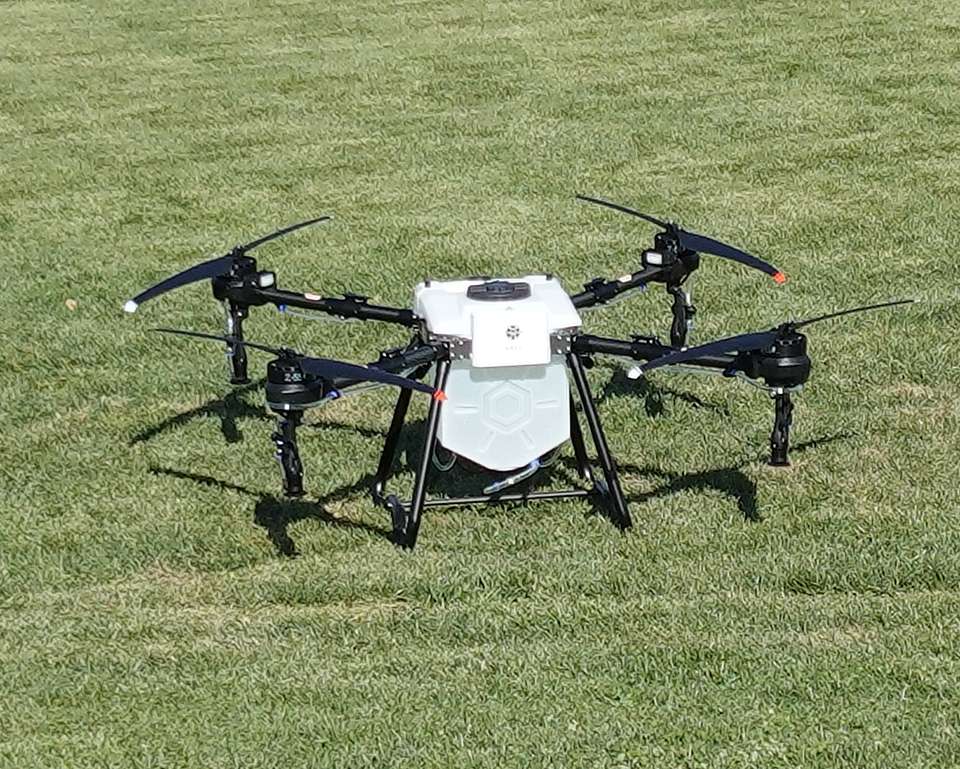 A large drone sits on a lawn, preparing to take off. (Photo courtesy K-State News and Communications)