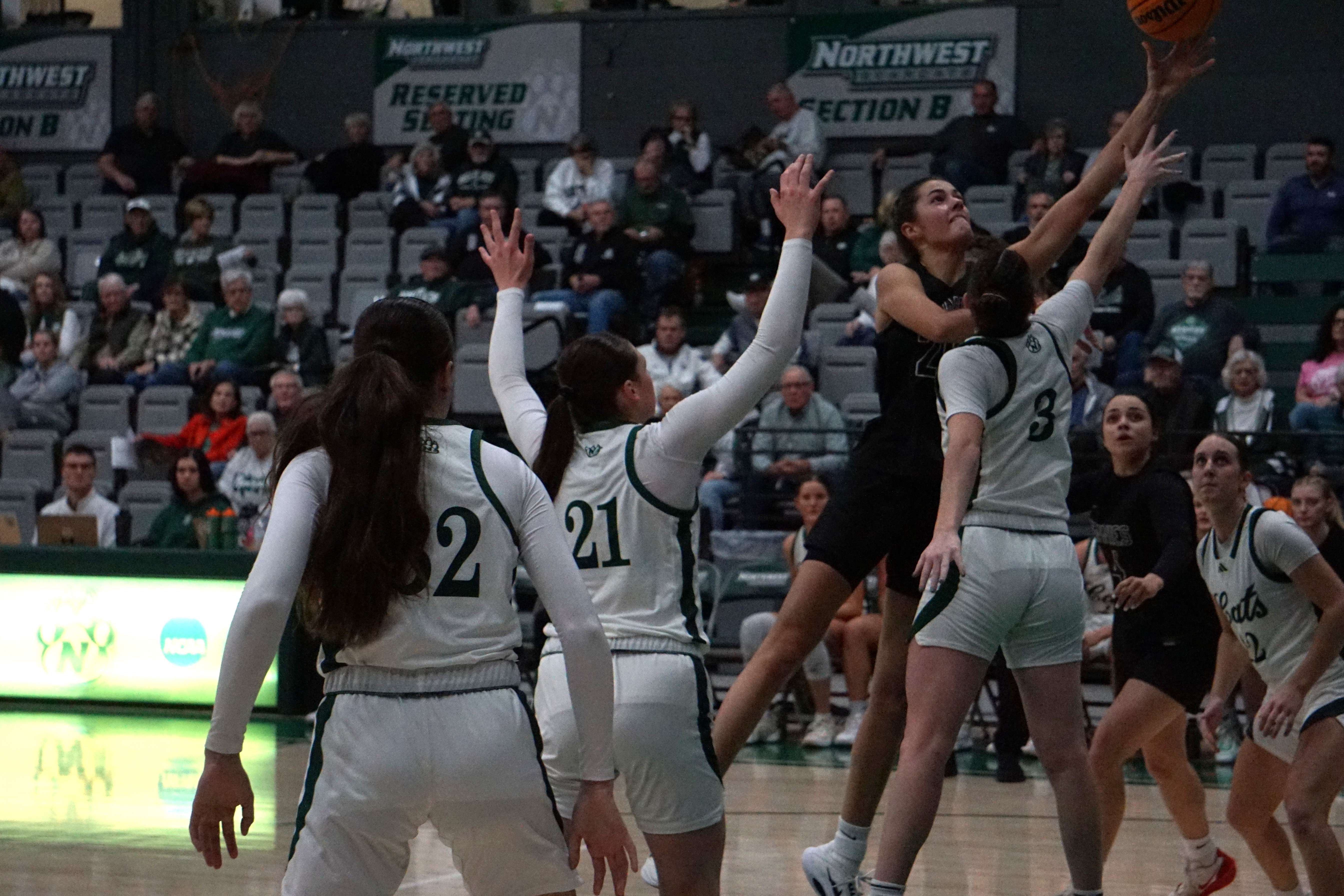 UCM's Taylor Weishaar. a former standout at Riverside, drives into the lane against Northwest's Andrea Lopreato (3)/ Photo by Matt Pike