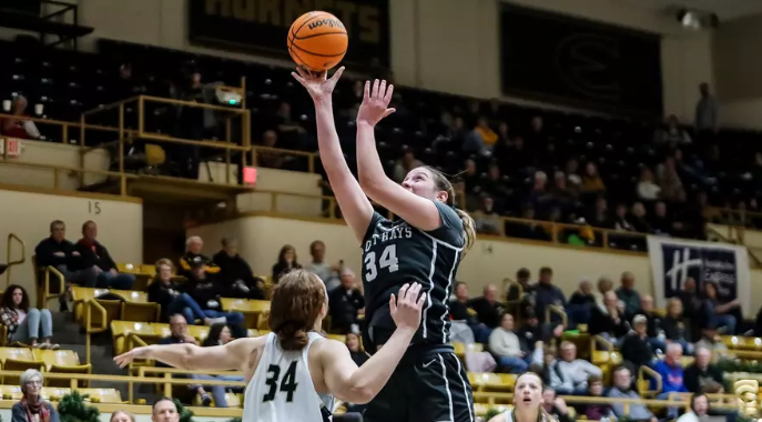 Fort Hays State's Kaitlin Schumann (34) goes up for a shot over Emporia State's Macey Gandee (34) on Thursday, January 8, 2026 in Emporia, Kan. (FHSU Athletics photo/Mason Hart/ESU Athletics)