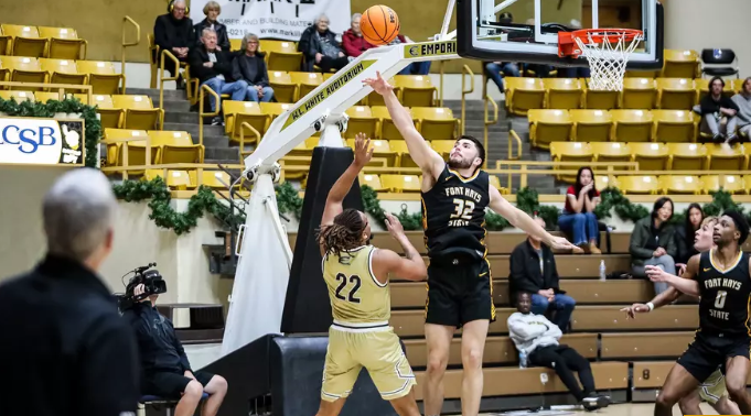 Fort Hays State's Eli Lawson (32) blocks the shot of Emporia State's Treyvon Taylor (22) in the second half of their college basketball game on Thursday, January 8., 2026 in Emporia, Kan. (FHSU Athletics photo/Mason Hart/ESU Athletics)
