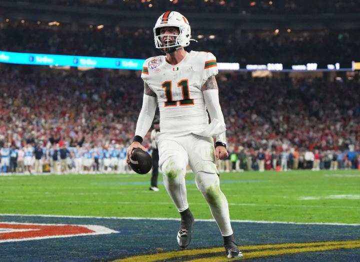 Miami quarterback Carson Beck scores a touchdown during the second half of the Fiesta Bowl NCAA college football playoff semifinal game against Mississippi, Thursday, Jan. 8, 2026, in Glendale, Ariz. (AP Photo/Rick Scuteri)