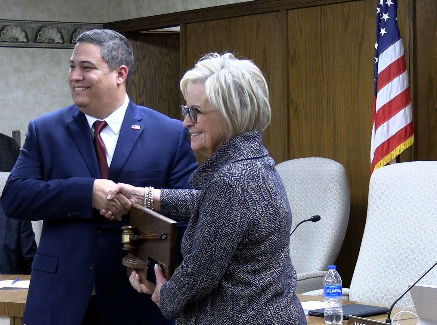 Mason Ruder, Hays mayor, thanks outgoing mayor Sandy Jacobs for her service. Jacobs was re-elected in November for a four-year term. Photo by Becky Kiser/Hays Post