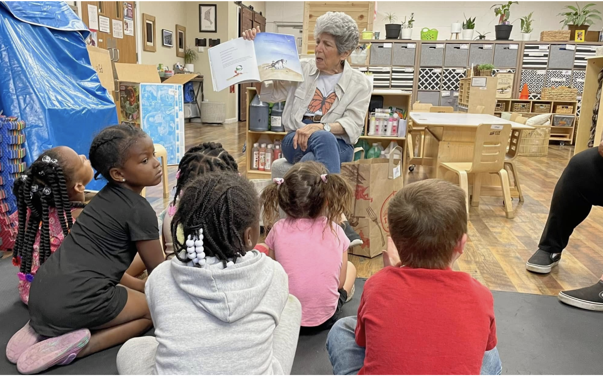  Barbara Swartz reads to children at Baden Christian Child Care in St. Louis last winter (photo submitted).