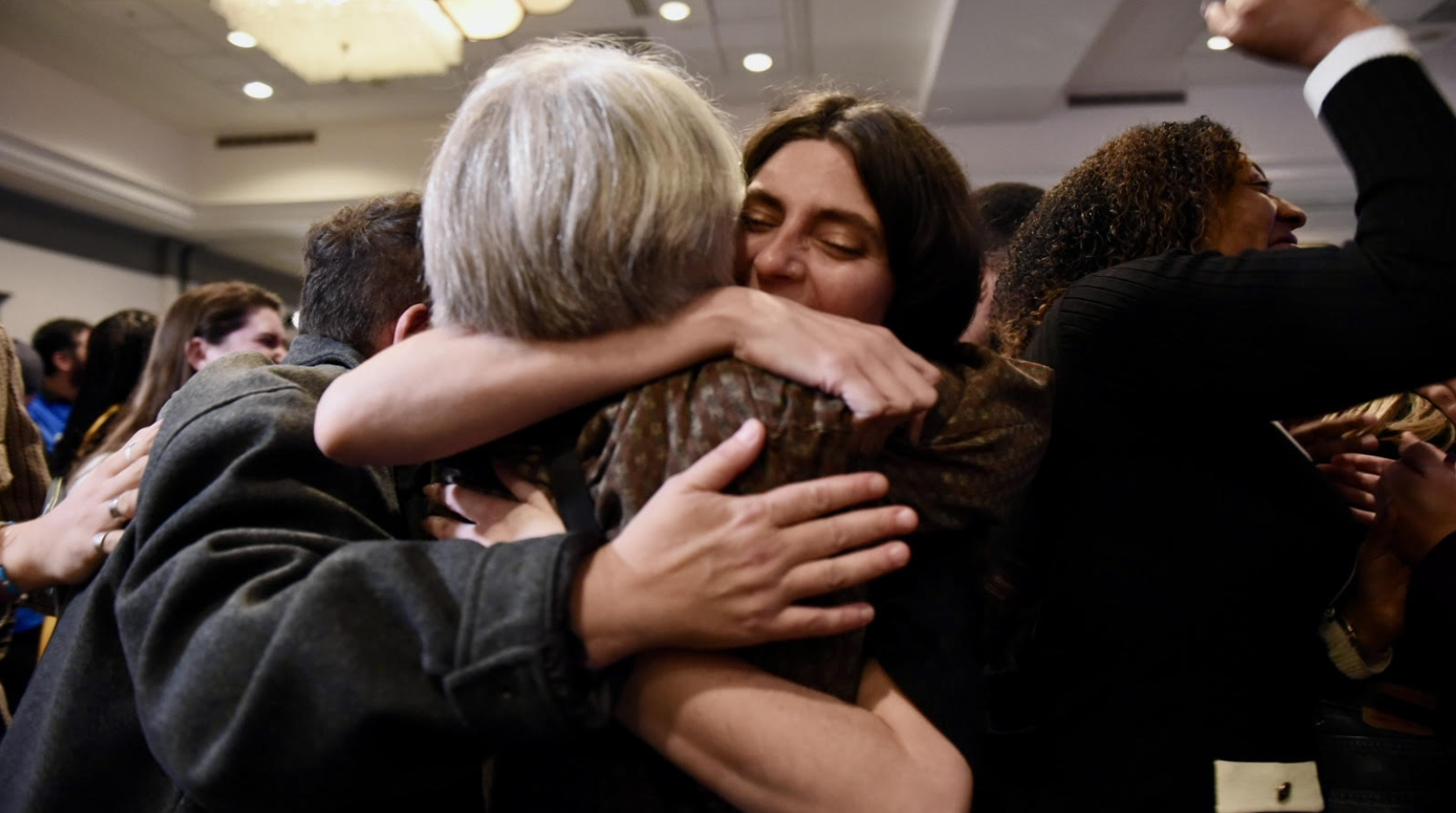 Maggie Olivia, a senior policy manager with Abortion Action Missouri, embraces abortion-rights supporters after the race is called in favor of Amendment 3 on Tuesday, Nov. 5, 2024, in St. Louis (Anna Spoerre/Missouri Independent).