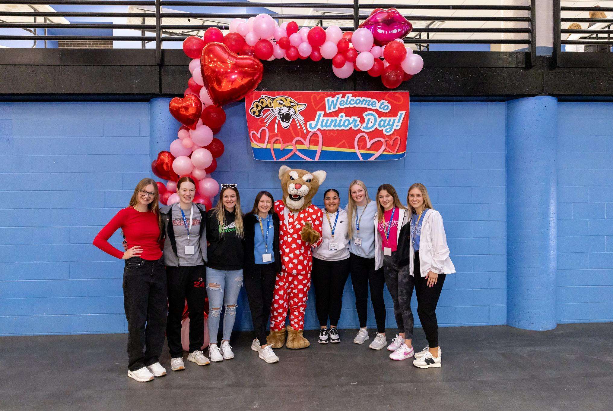 A group of students pose for a photo with Bart the Cougar at last year's Junior Day event on the Barton Campus.