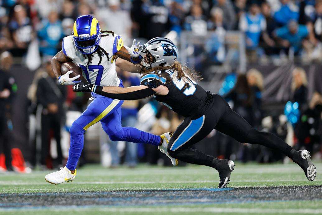 Los Angeles Rams wide receiver Davante Adams (17) is tackled by Carolina Panthers linebacker Christian Rozeboom during the second half of an NFL wild-card playoff football game, Saturday, Jan. 10, 2026, in Charlotte, N.C. (AP Photo/Rusty Jones)