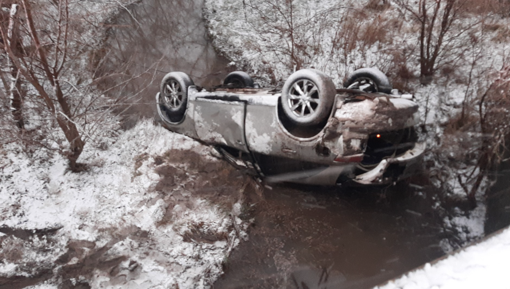2006 Infiniti SUV on its hood after the driver was traveling too fast on slick road conditions in Saline County on January 9. Photo by the Saline County Sheriff's Office