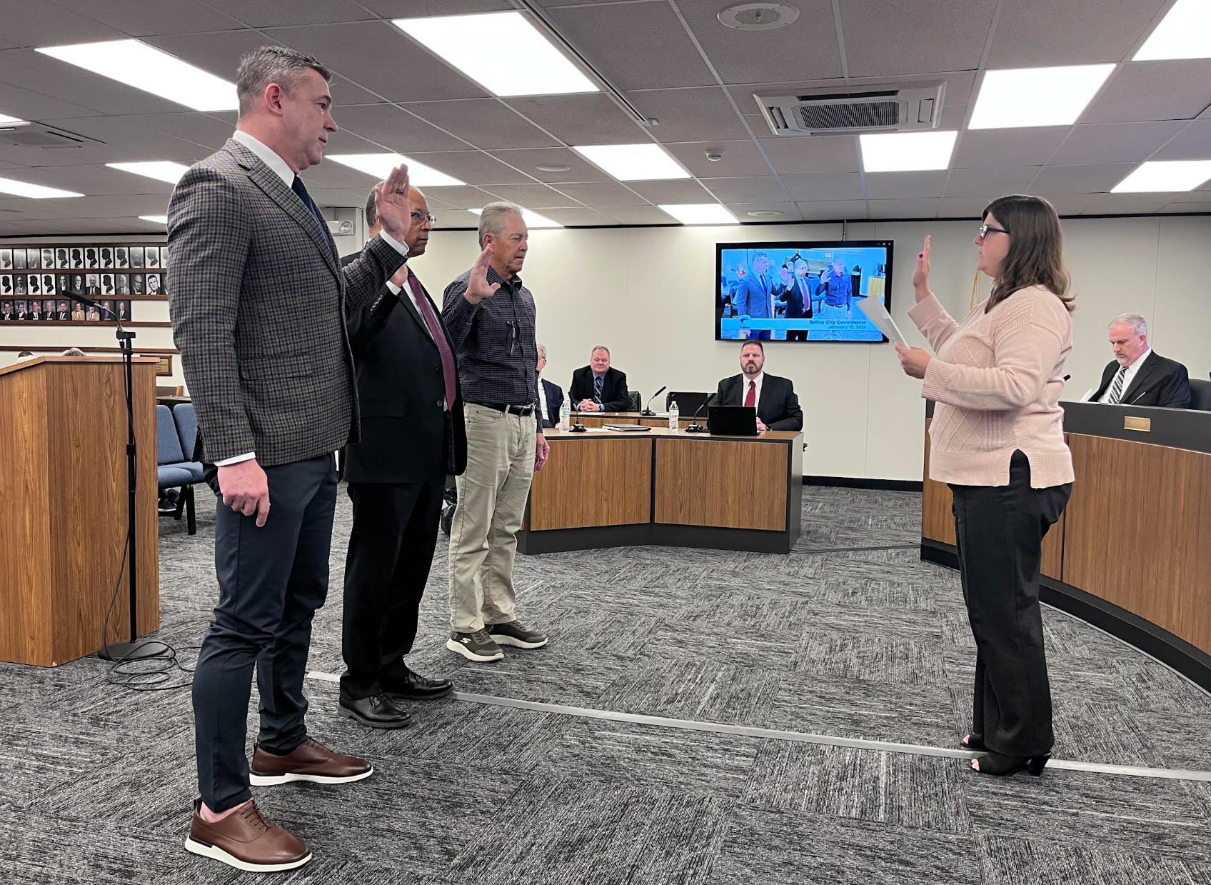 Commissioners Greg Lenkiewicz (left), Dr. Trent Davis (middle) and new-elect Doug Rempp (right) sworn in during Monday's City Commission meeting on January 12. Photo by Nicolas Fierro