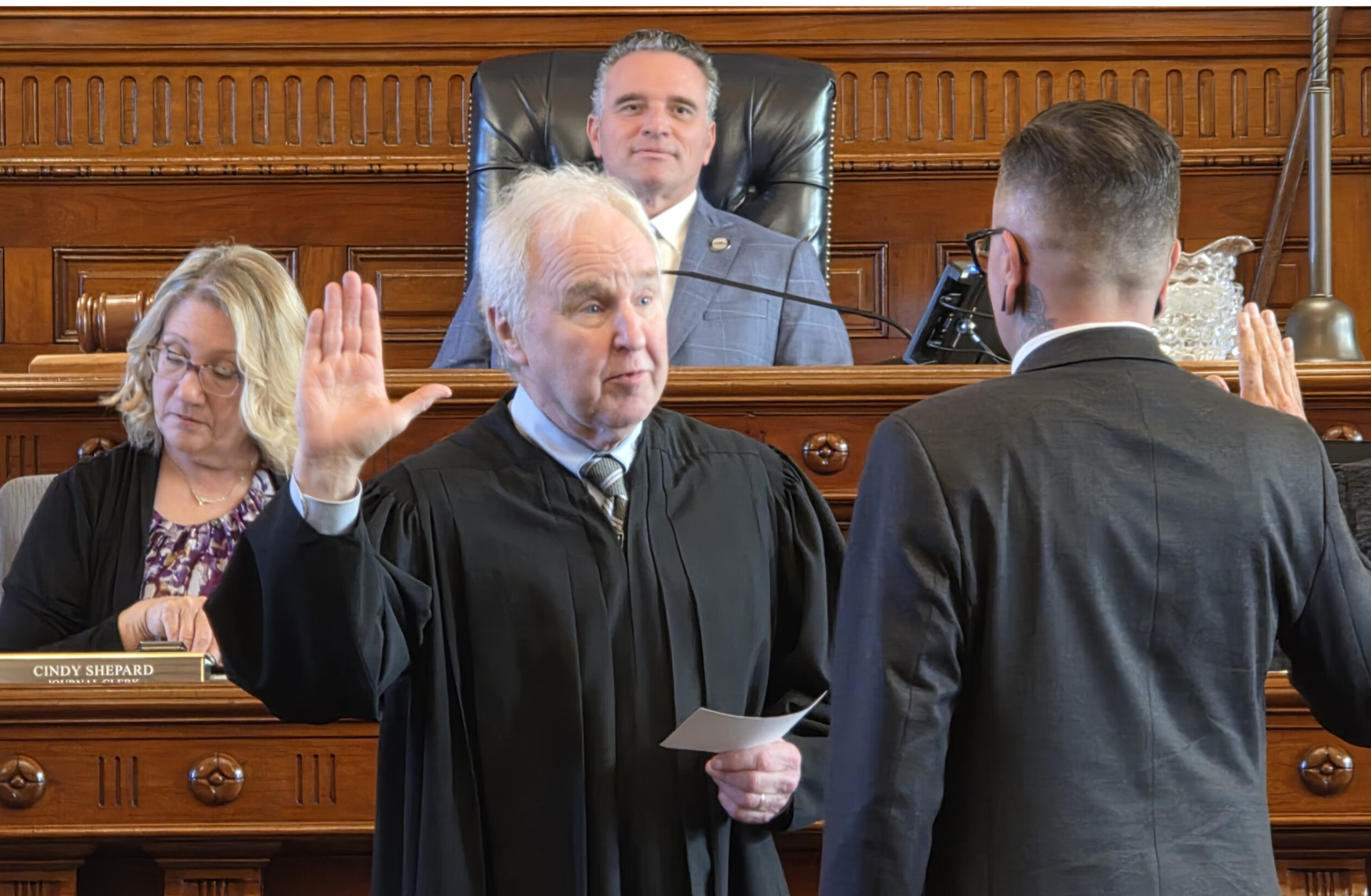 Kansas Supreme Court Chief Justice Eric Rosen swears in new senator Silas Miller, a Democrat from Wichita, on the first day of the 2026 legislative session. (Photo by Morgan Chilson/Kansas Reflector)