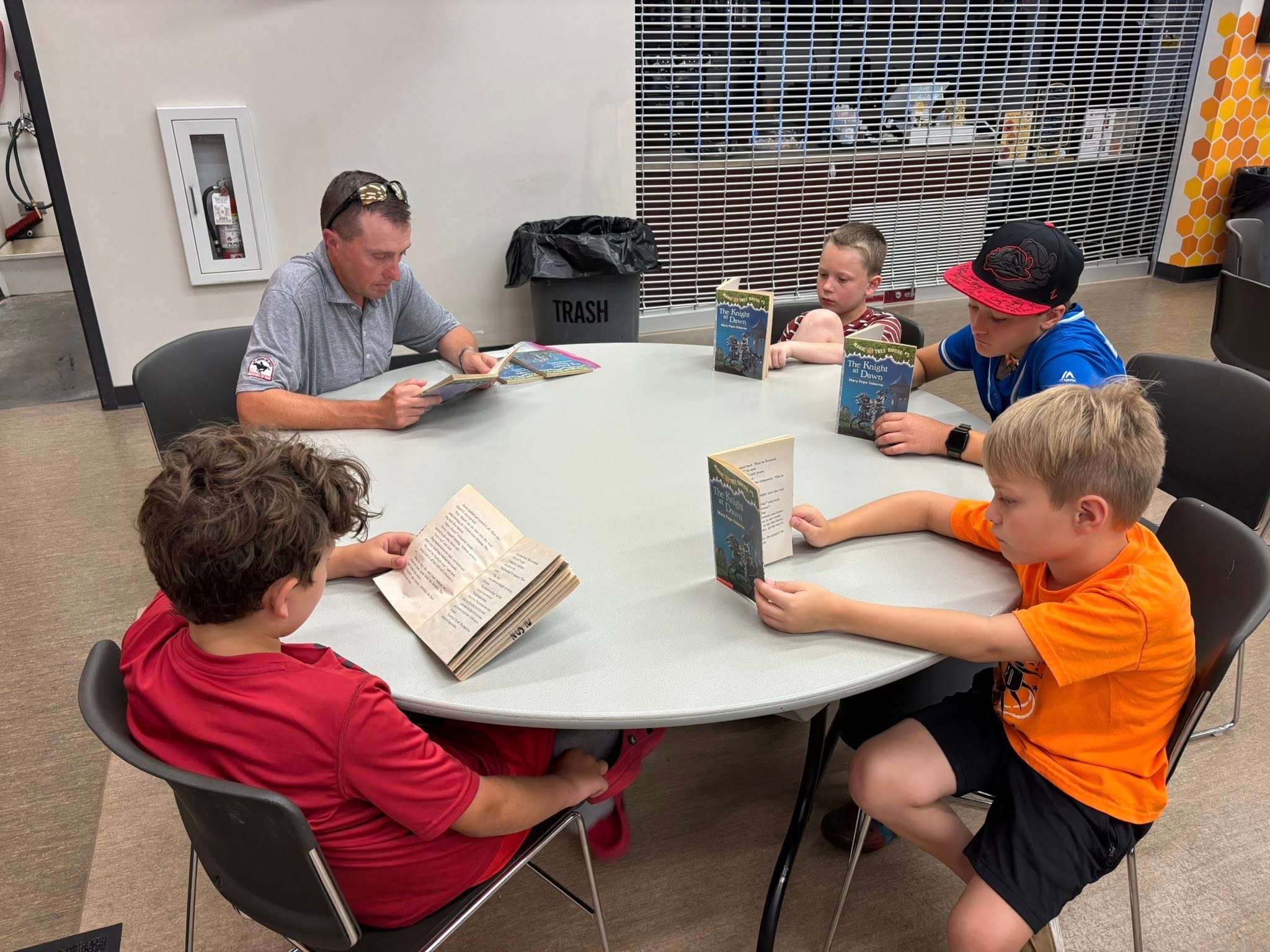 St. Joseph Sports Commission Director Brett Esely reading with students as part of United Way of Greater St. Joseph's Reading Adventure's Program.&nbsp; Volunteers are needed to read in schools, starting later this month/ Photo courtesy of United Way of Greater St. Joseph