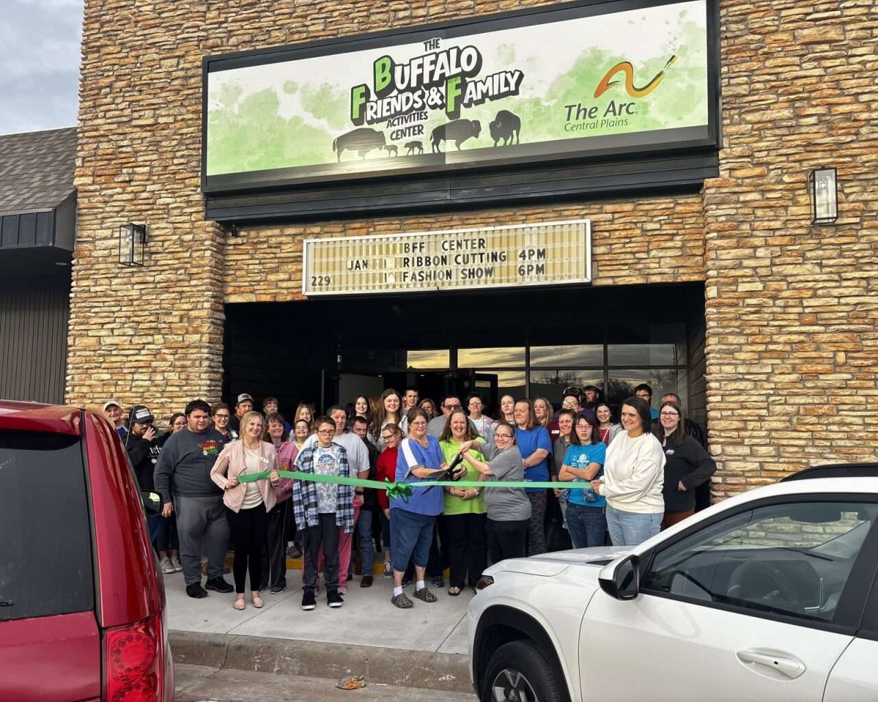 The Arc of Central Plains and Hays Buffaloes celebrating the opening of its new activity center in Hays with a ribbon-cutting. Photo by Tony Guerrero/Hays Post