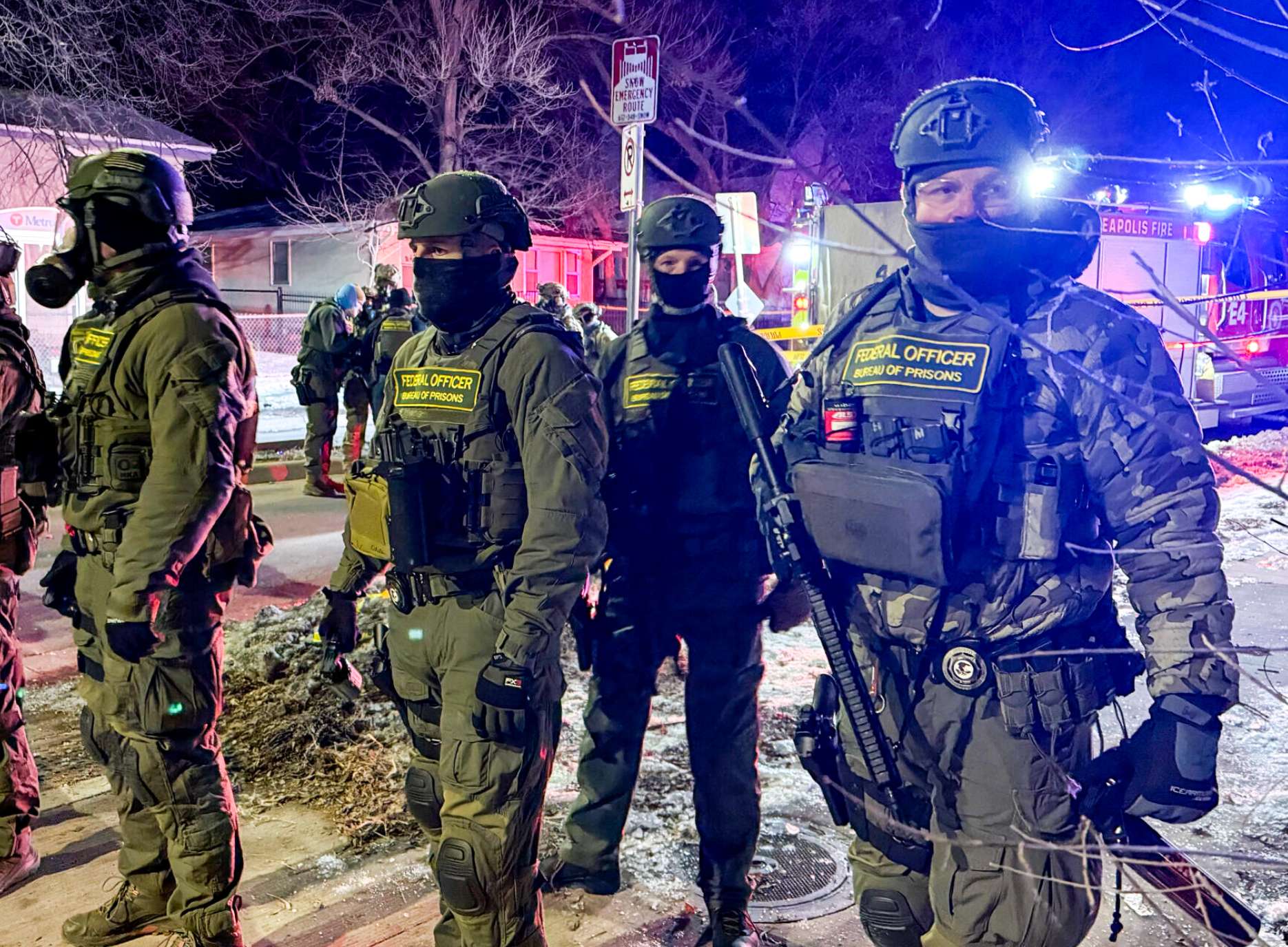 Federal Bureau of Prisons officers on the scene where a federal immigration agent shot a man Wednesday, Jan. 14, 2026, in north Minneapolis. (Photo by Max Nesterak/Minnesota Reformer)